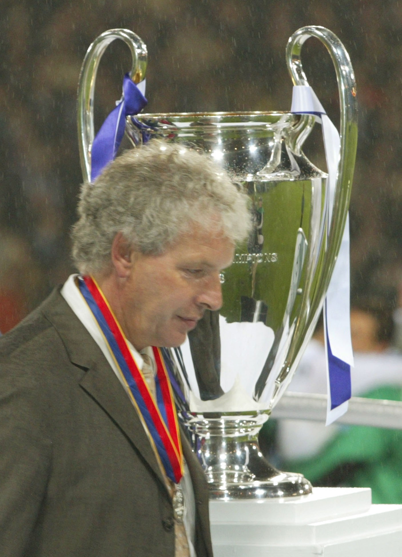A dejected Klaus Toppmoller, coach of Bayer Leverkusen, walks past the trophy, after his side was defeated by Real Madrid in the UEFA Champions League Final at Hampden Park stadium in Glasgow, Scotland, Wednesday May 15, 2002.(AP Photo/Frank Augstein)