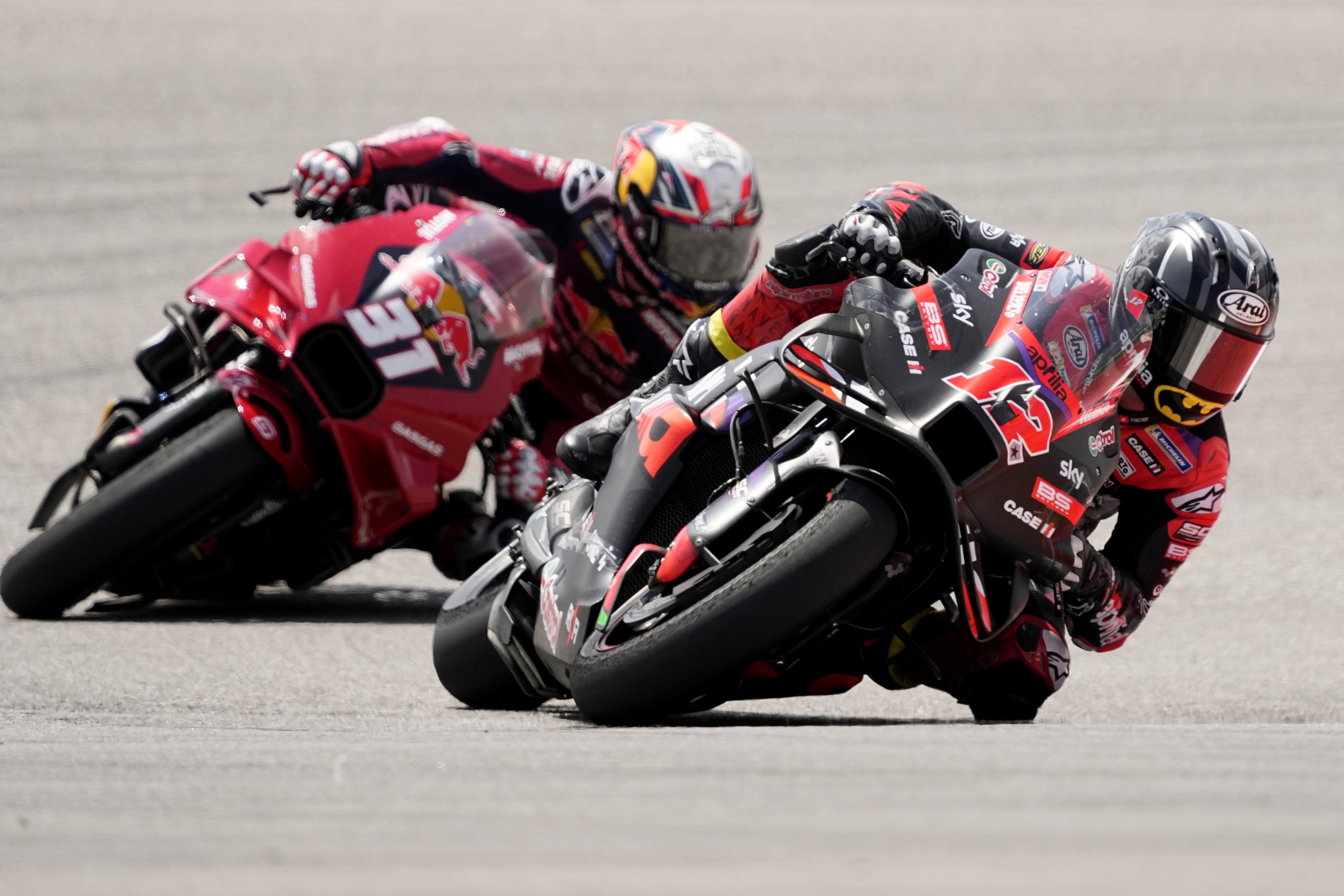 Maverick Vinales (12), of Spain, leads Pedro Acosta (31), also of Spain, through a turn during the MotoGP Grand Prix of the Americas motorcycle race at Circuit of the Americas, Sunday, April 14, 2024, in Austin, Texas. Vinales won the race; Acosta finished second. (AP Photo/Eric Gay)