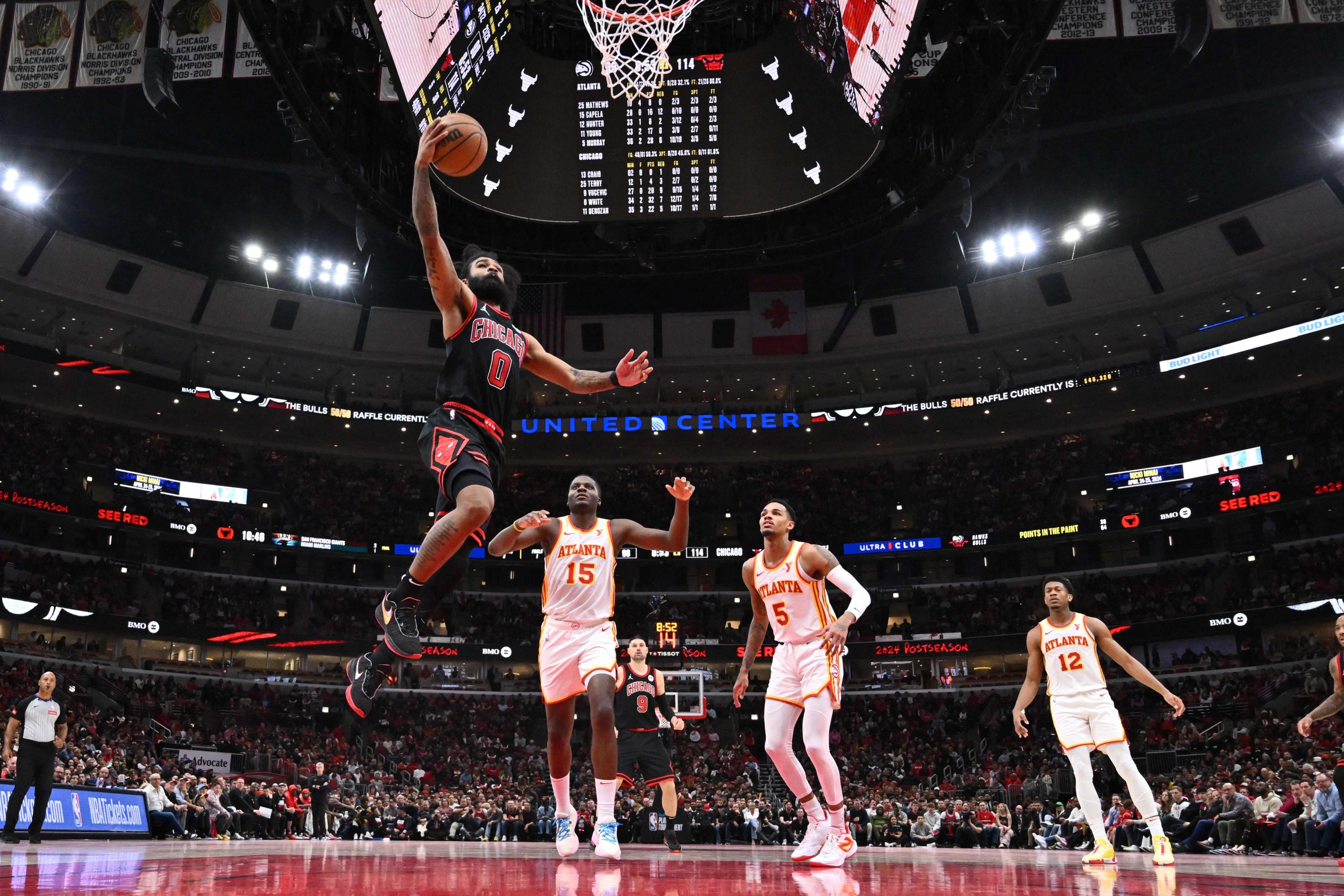 CHICAGO, ILLINOIS - APRIL 17: Coby White #0 of the Chicago Bulls drives to the basket in the second half against the Atlanta Hawks during a play-in tournament game at United Center on April 17, 2024 in Chicago, Illinois. Chicago defeated Atlanta 131-116. NOTE TO USER: User expressly acknowledges and agrees that, by downloading and or using this photograph, User is consenting to the terms and conditions of the Getty Images License Agreement.   Jamie Sabau/Getty Images/AFP (Photo by Jamie Sabau / GETTY IMAGES NORTH AMERICA / Getty Images via AFP)