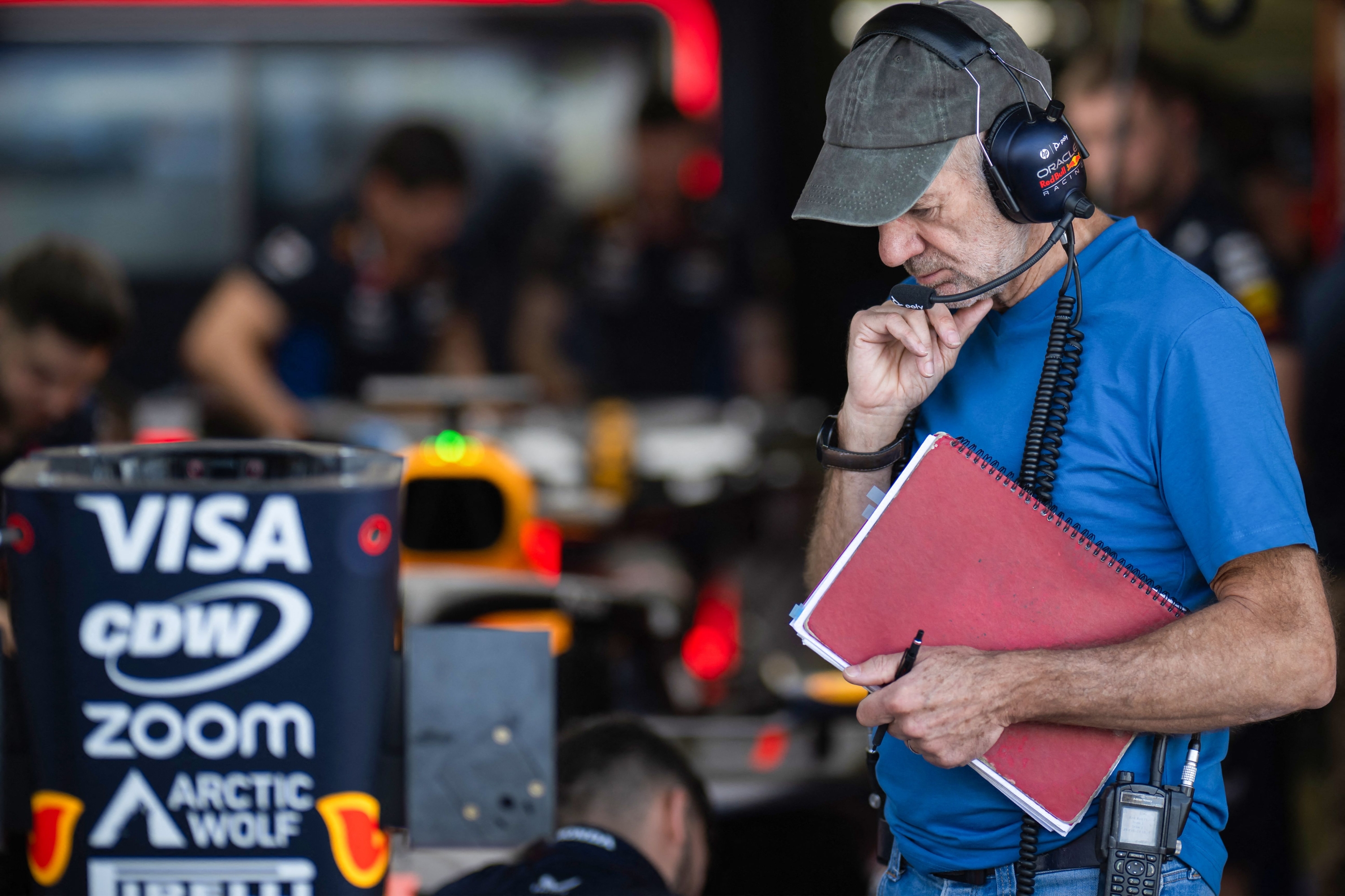 Red Bull Racing Formula One team technical chief Adrian Newey looks on in the team garage during the first day of the Formula One pre-season testing at the Bahrain International Circuit in Sakhir on February 21, 2024. (Photo by Andrej ISAKOVIC / AFP)