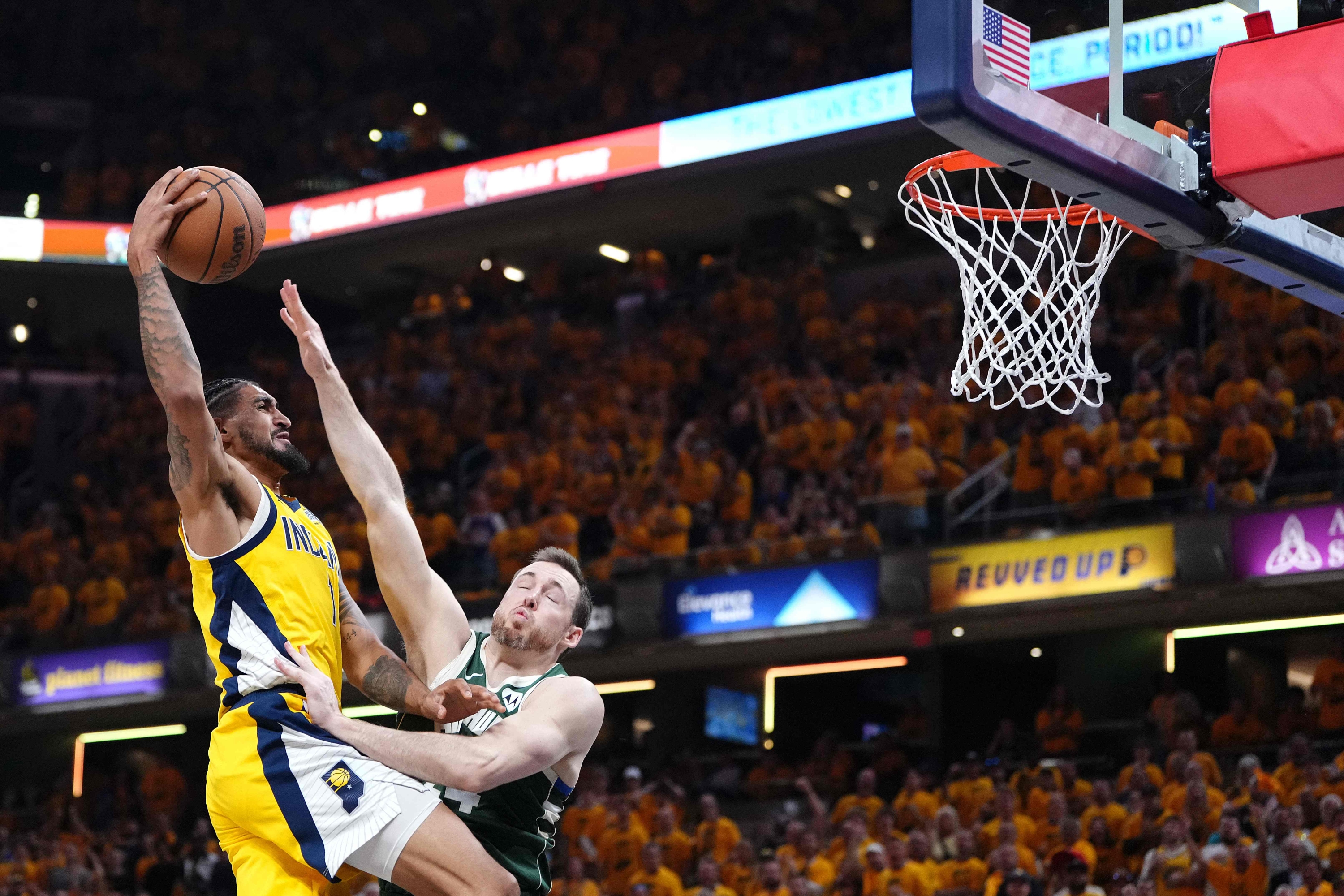 INDIANAPOLIS, INDIANA - MAY 02: Obi Toppin #1 of the Indiana Pacers goes up for a basket while defended by Pat Connaughton #24 of the Milwaukee Bucksduring the first quarter of game six of the Eastern Conference First Round Playoffs at Gainbridge Fieldhouse on May 02, 2024 in Indianapolis, Indiana.   Dylan Buell/Getty Images/AFP (Photo by Dylan Buell / GETTY IMAGES NORTH AMERICA / Getty Images via AFP)