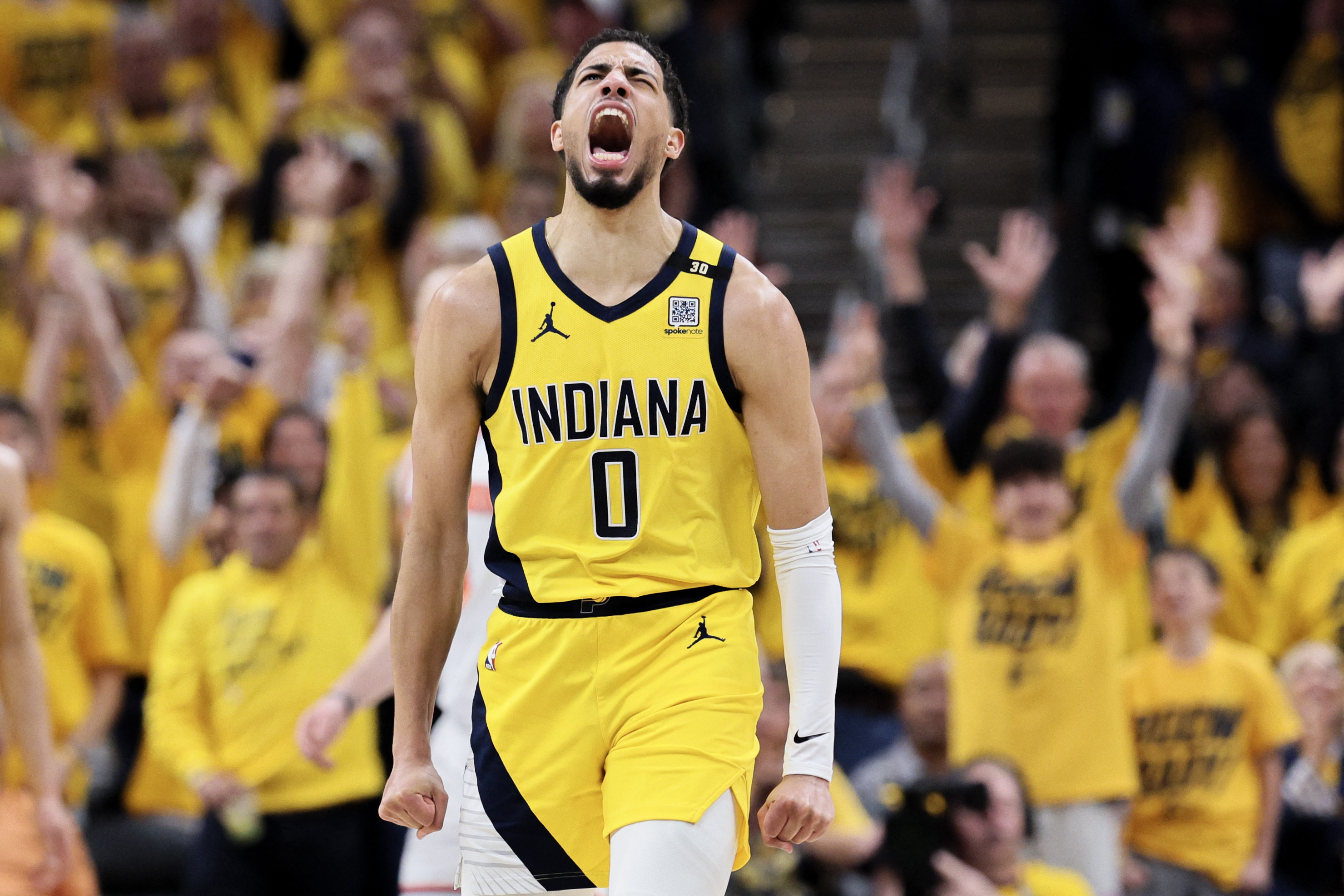 INDIANAPOLIS, INDIANA - MAY 10: Tyrese Haliburton #0 of the Indiana Pacers reacts after his made three-point basket against the New York Knicks during the second quarter in Game Three of the Eastern Conference Second Round Playoffs at Gainbridge Fieldhouse on May 10, 2024 in Indianapolis, Indiana. NOTE TO USER: User expressly acknowledges and agrees that, by downloading and or using this photograph, User is consenting to the terms and conditions of the Getty Images License Agreement.   Andy Lyons/Getty Images/AFP (Photo by ANDY LYONS / GETTY IMAGES NORTH AMERICA / Getty Images via AFP)