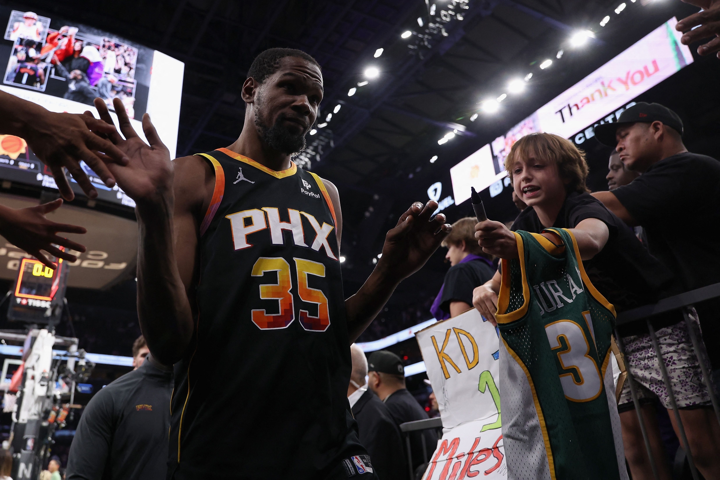 PHOENIX, ARIZONA - APRIL 28: Kevin Durant #35 of the Phoenix Suns walks off the court after being defeated in game four of the Western Conference First Round Playoffs at Footprint Center on April 28, 2024 in Phoenix, Arizona. The Timberwolves defeated the Suns 122-116 and win the series 4-0. NOTE TO USER: User expressly acknowledges and agrees that, by downloading and or using this photograph, User is consenting to the terms and conditions of the Getty Images License Agreement.   Christian Petersen/Getty Images/AFP (Photo by Christian Petersen / GETTY IMAGES NORTH AMERICA / Getty Images via AFP)