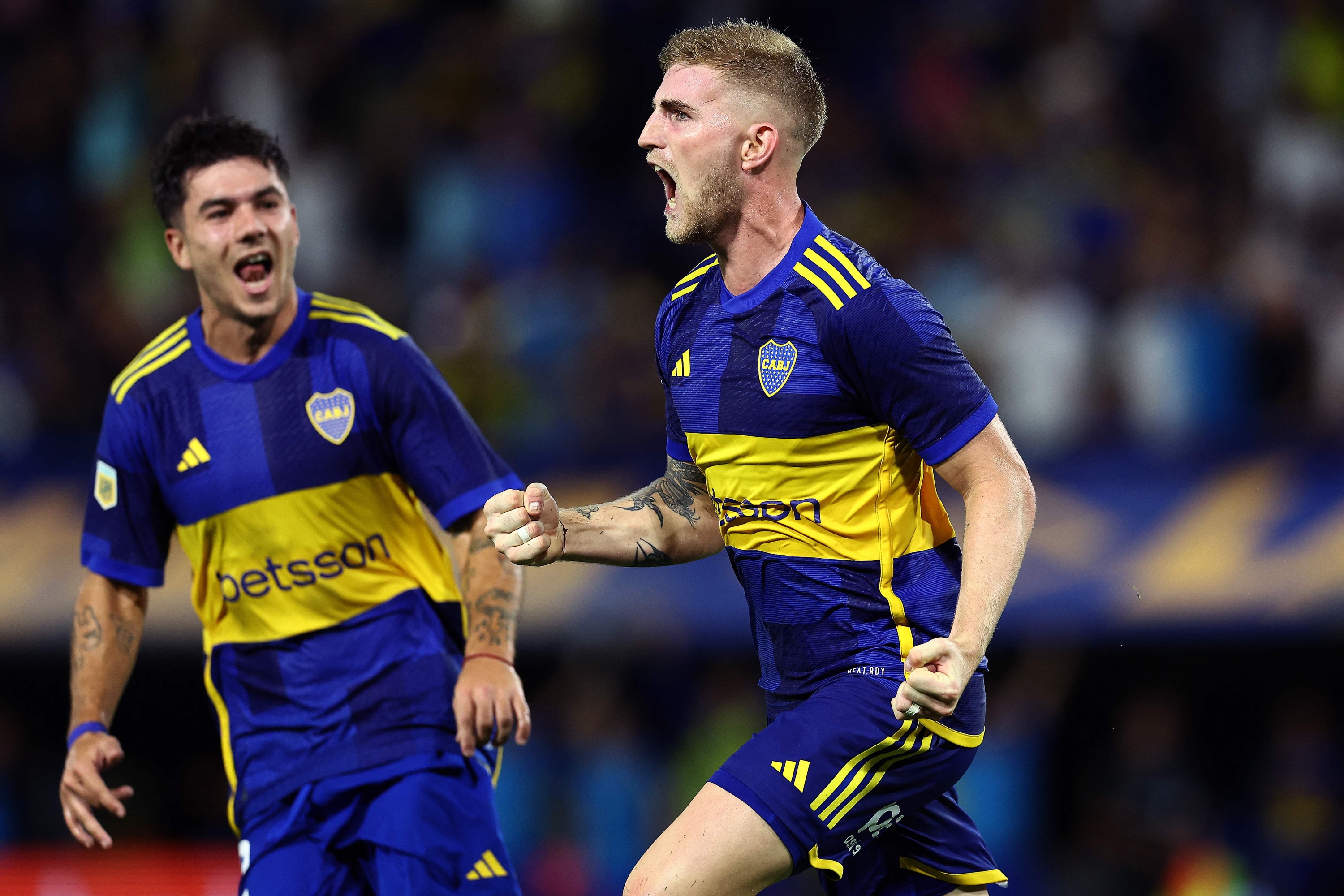 Boca Juniors' defender Nicolas Valentini (R) celebrates with teammate Lucas Blondel after scoring his team's fourth goal during the Argentine Professional Football League Cup 2024 match between Boca Juniors and Racing Club at La Bombonera stadium in Buenos Aires on March 10, 2024. (Photo by ALEJANDRO PAGNI / AFP)