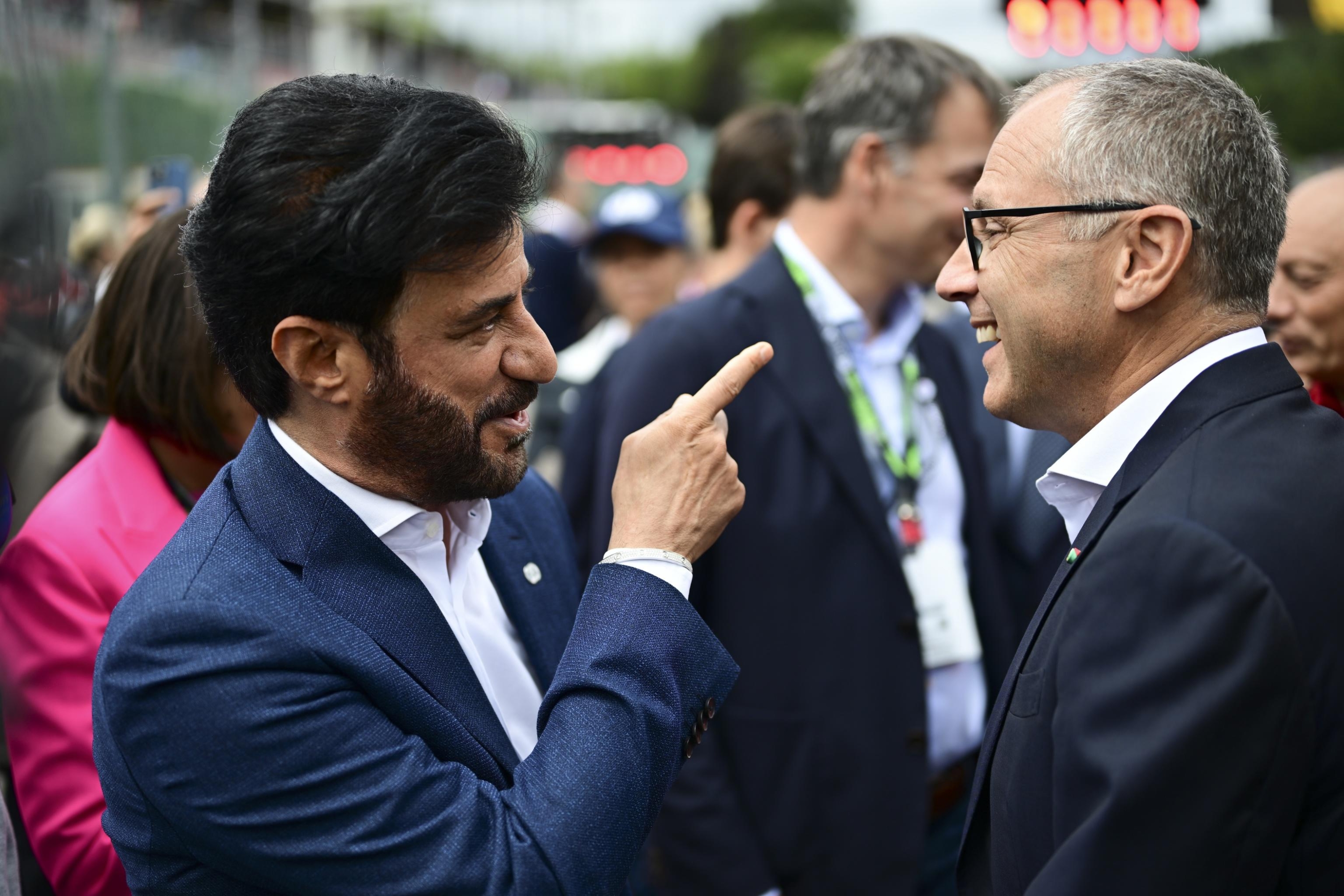 epa10777172 Emirati Mohammed Bin Sulayem (L), President of FIA, and Stefano Domenicali (R), CEO of Formula One Group react prior to the 2023 Formula 1 Belgian Grand Prix at the Circuit de Spa-Francorchamps racetrack in Stavelot, Belgium, 30 July 2023.  EPA/CHRISTIAN BRUNA