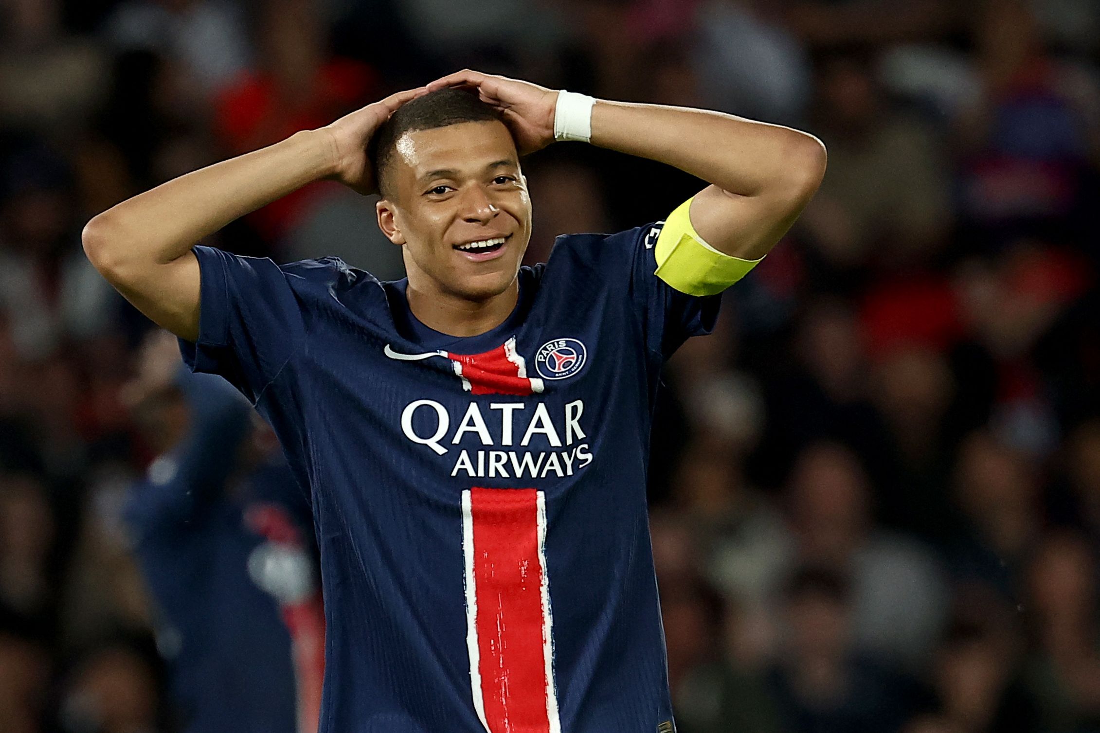 Paris Saint-Germain's French forward #07 Kylian Mbappe reacts after missing a goal opportunity during the French L1 football match between Paris Saint-Germain (PSG) and Toulouse (TFC) on May 12, 2024 at the Parc des Princes stadium in Paris. (Photo by FRANCK FIFE / AFP)