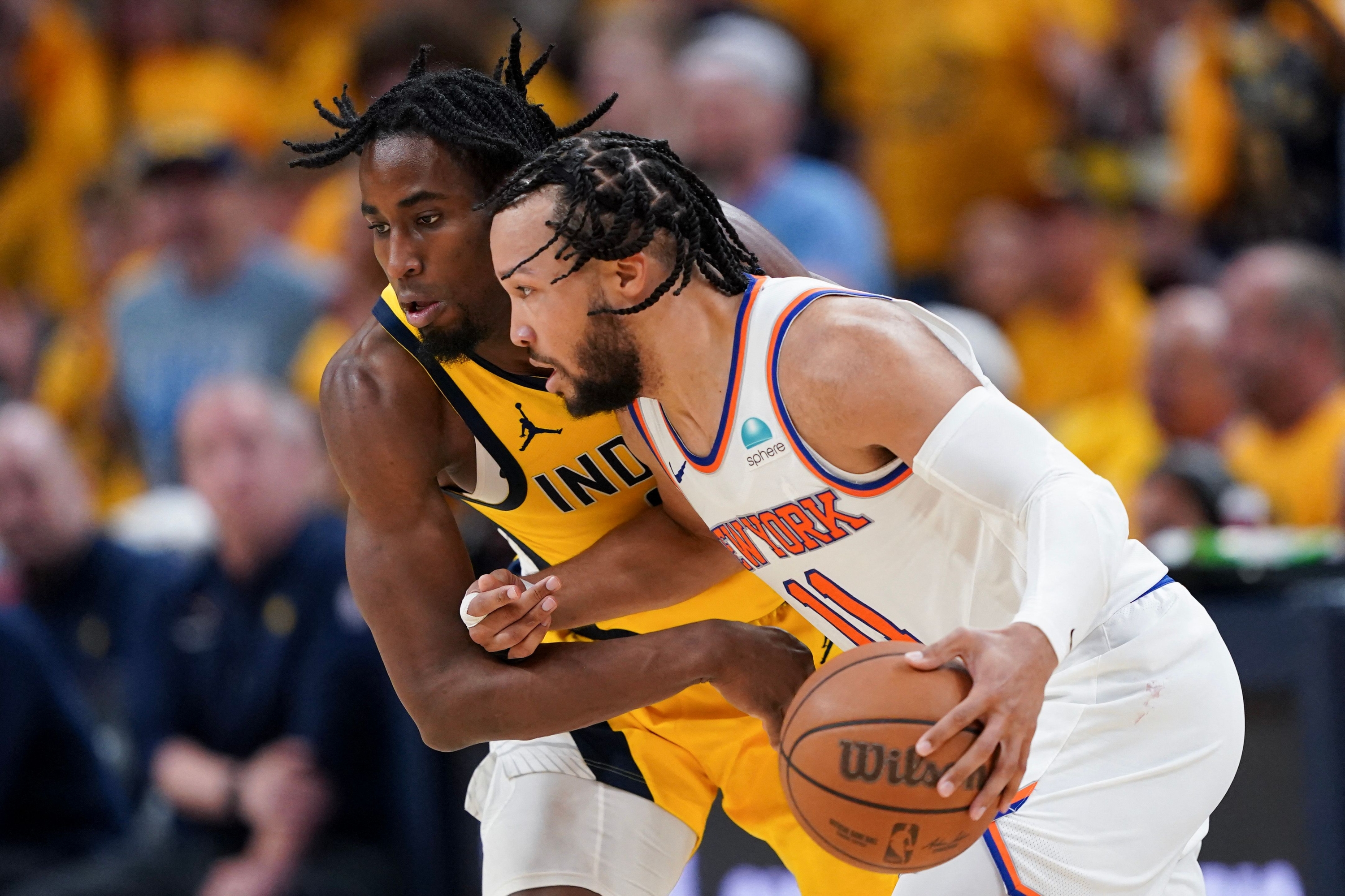 INDIANAPOLIS, INDIANA - MAY 17: Jalen Brunson #11 of the New York Knicks dribbles the ball against Aaron Nesmith #23 of the Indiana Pacers during the third quarter in Game Six of the Eastern Conference Second Round Playoffs at Gainbridge Fieldhouse on May 17, 2024 in Indianapolis, Indiana. NOTE TO USER: User expressly acknowledges and agrees that, by downloading and or using this photograph, User is consenting to the terms and conditions of the Getty Images License Agreement.   Dylan Buell/Getty Images/AFP (Photo by Dylan Buell / GETTY IMAGES NORTH AMERICA / Getty Images via AFP)