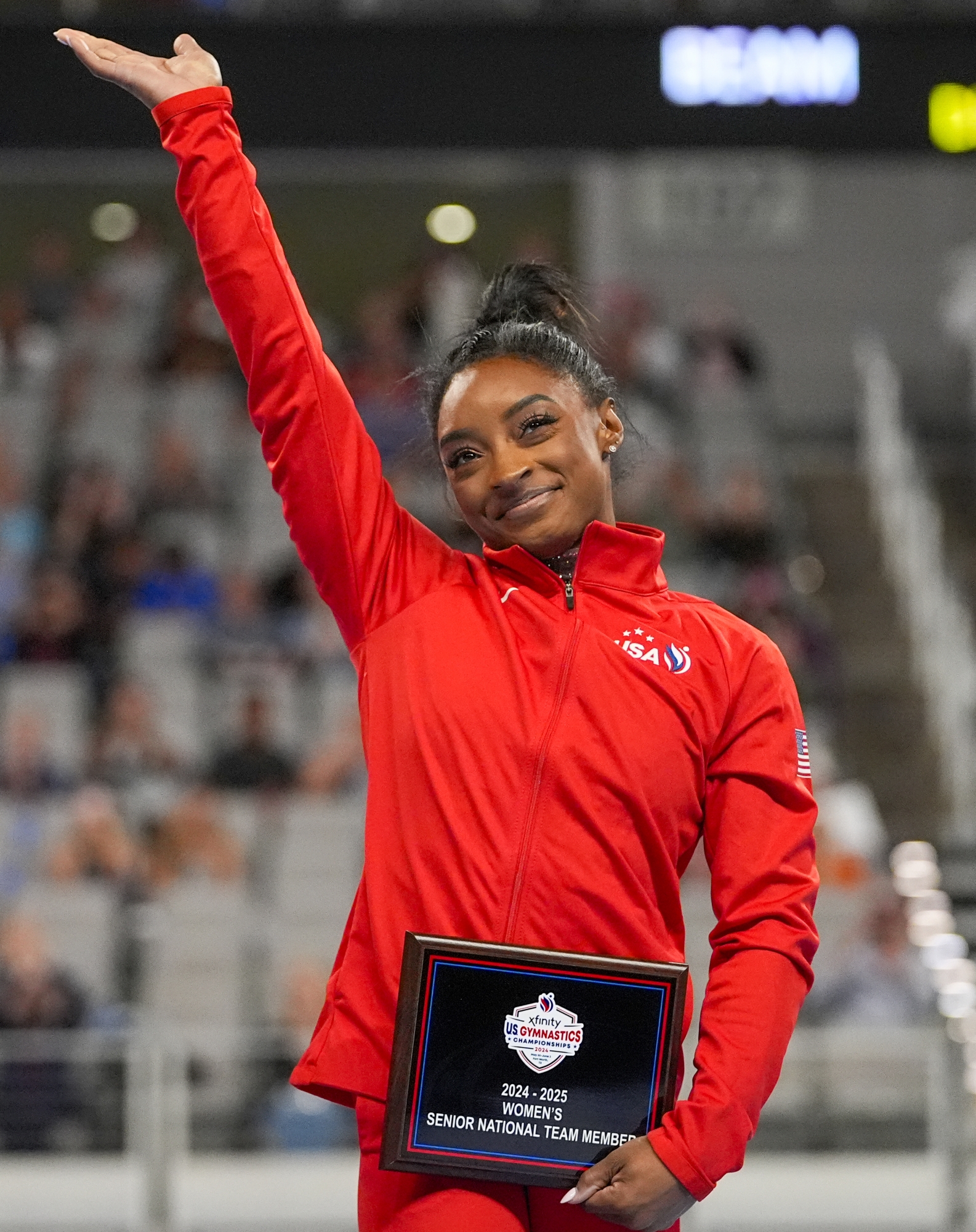 Simone Biles reacts after being named to the U.S. women's senior national team during the U.S. Gymnastics Championships, Sunday, June 2, 2024, in Fort Worth, Texas. (AP Photo/Julio Cortez)