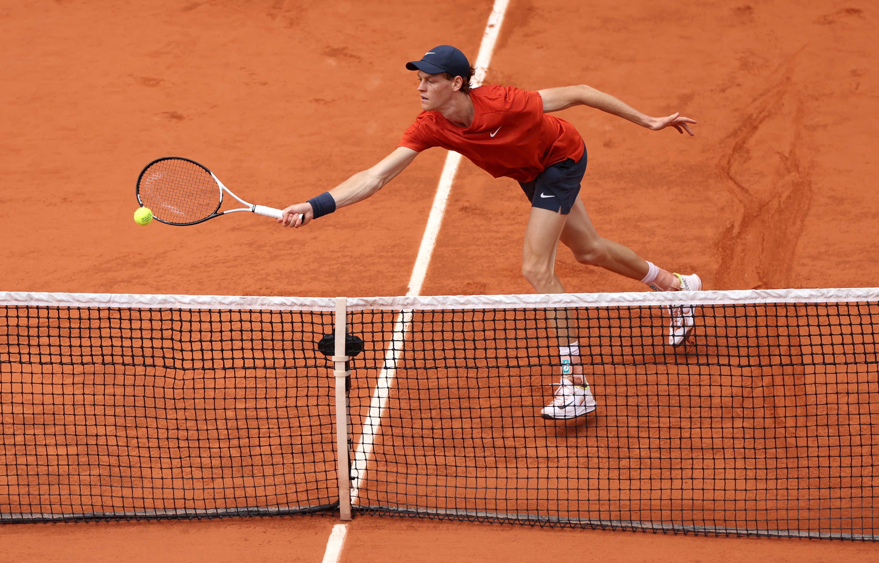 PARIS, FRANCE - JUNE 04: Jannik Sinner of Italy plays a forehand against Grigor Dimitrov of Bulgaria in the Men's Singles Quarter Final match during Day Ten of the 2024 French Open at Roland Garros on June 04, 2024 in Paris, France. (Photo by Dan Istitene/Getty Images)
