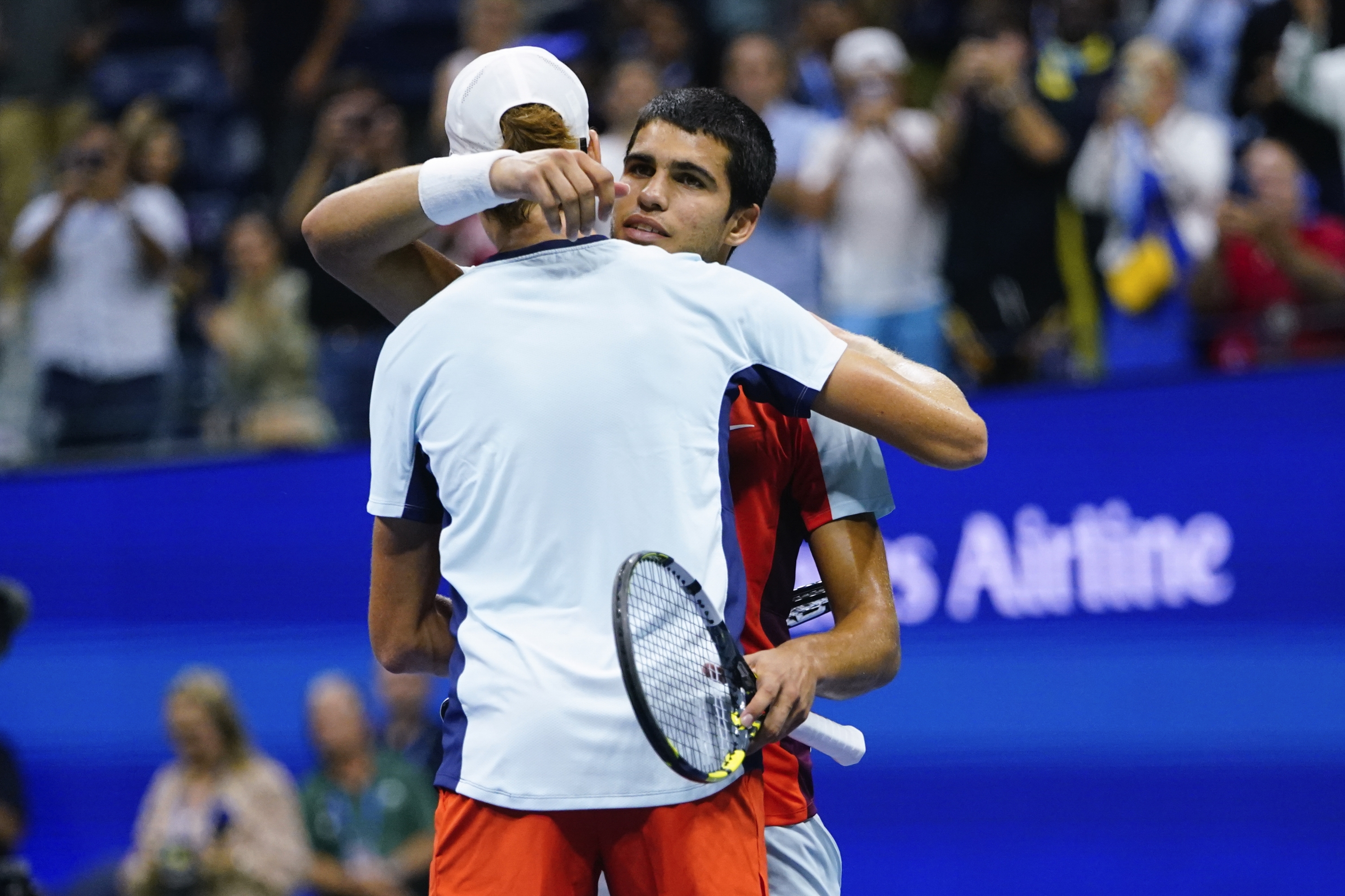 Carlos Alcaraz, of Spain, right, hugs Jannik Sinner, of Italy, after Alcaraz won their match in the quarterfinals of the U.S. Open tennis championships, early Thursday, Sept. 8, 2022, in New York. Alcaraz and Sinner will renew their rivalry on Friday June 7, 2024, in the French Open semifinals. (AP Photo/Frank Franklin II, File)
