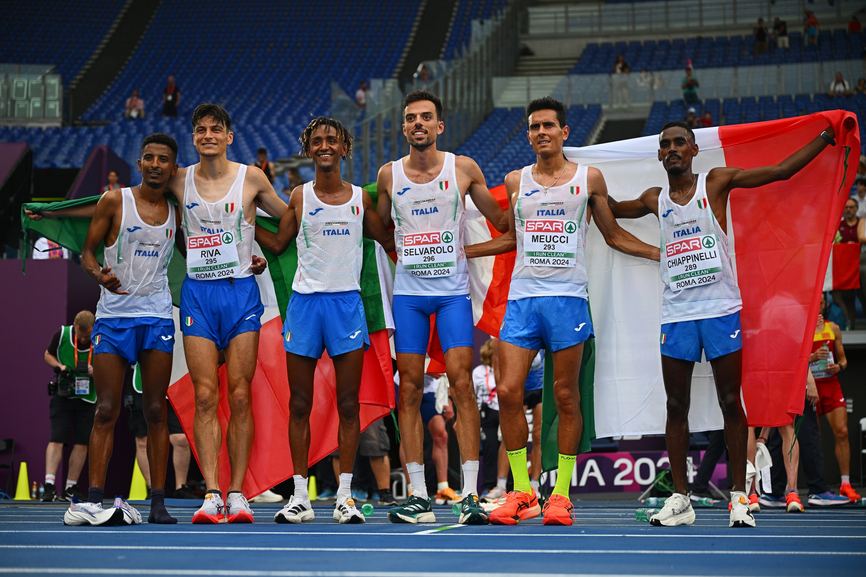 ROME, ITALY - JUNE 09: Eyob Faniel, Pietro Riva, Yemaneberhan Crippa, Pasquale Selvarolo, Daniele Meucci and Yohanes Chiappinelli of Team Italy celebrate following the Men's Half Marathon Final on day three of the 26th European Athletics Championships - Rome 2024 at Stadio Olimpico on June 09, 2024 in Rome, Italy. (Photo by Mattia Ozbot/Getty Images for European Athletics)