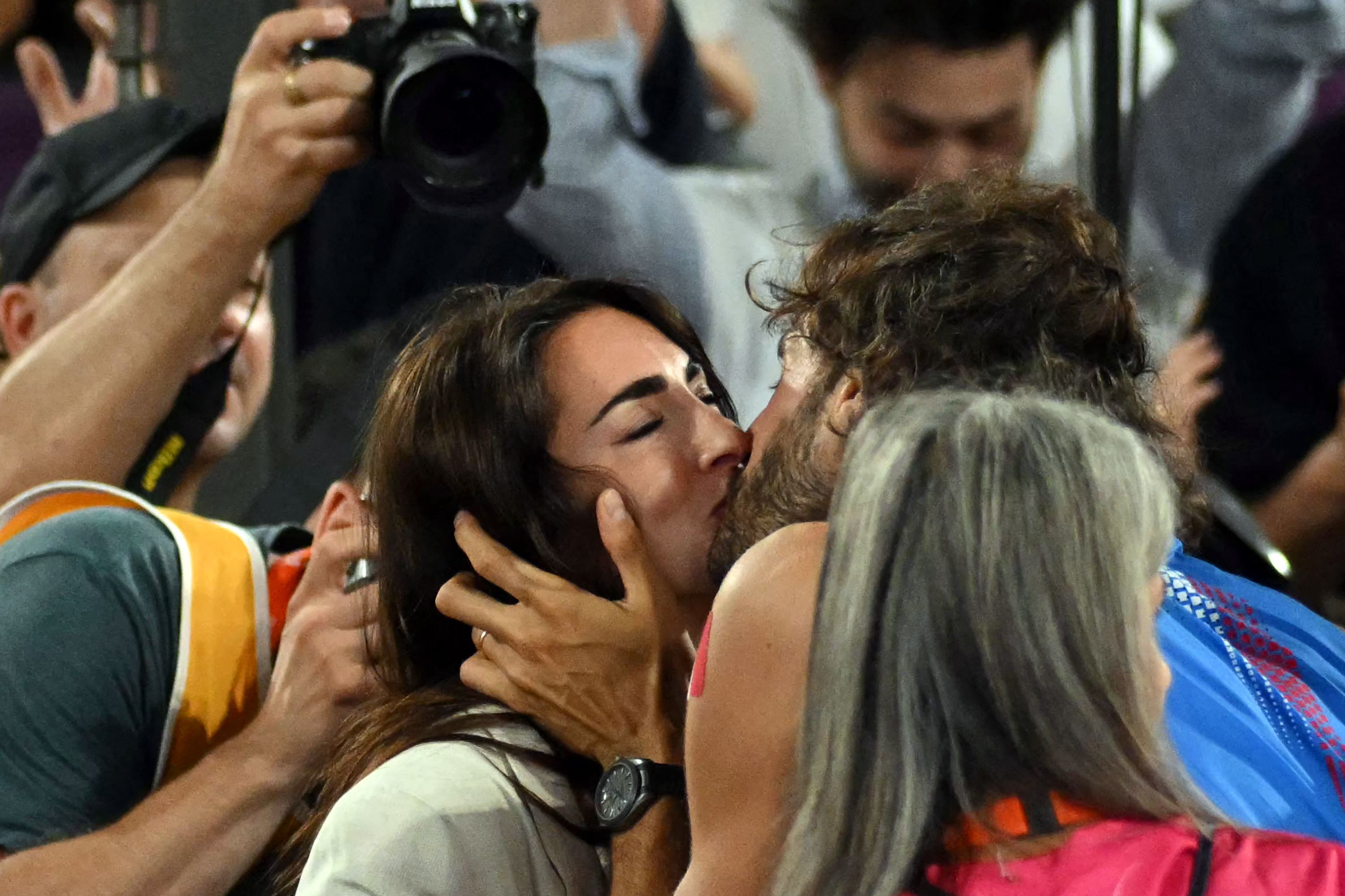 Italy's Gianmarco Tamberi kisses his wife Chiara Bontempi after winning the men's high jump final during the European Athletics Championships at the Olympic stadium in Rome on June 11, 2024. (Photo by Andreas SOLARO / AFP)
