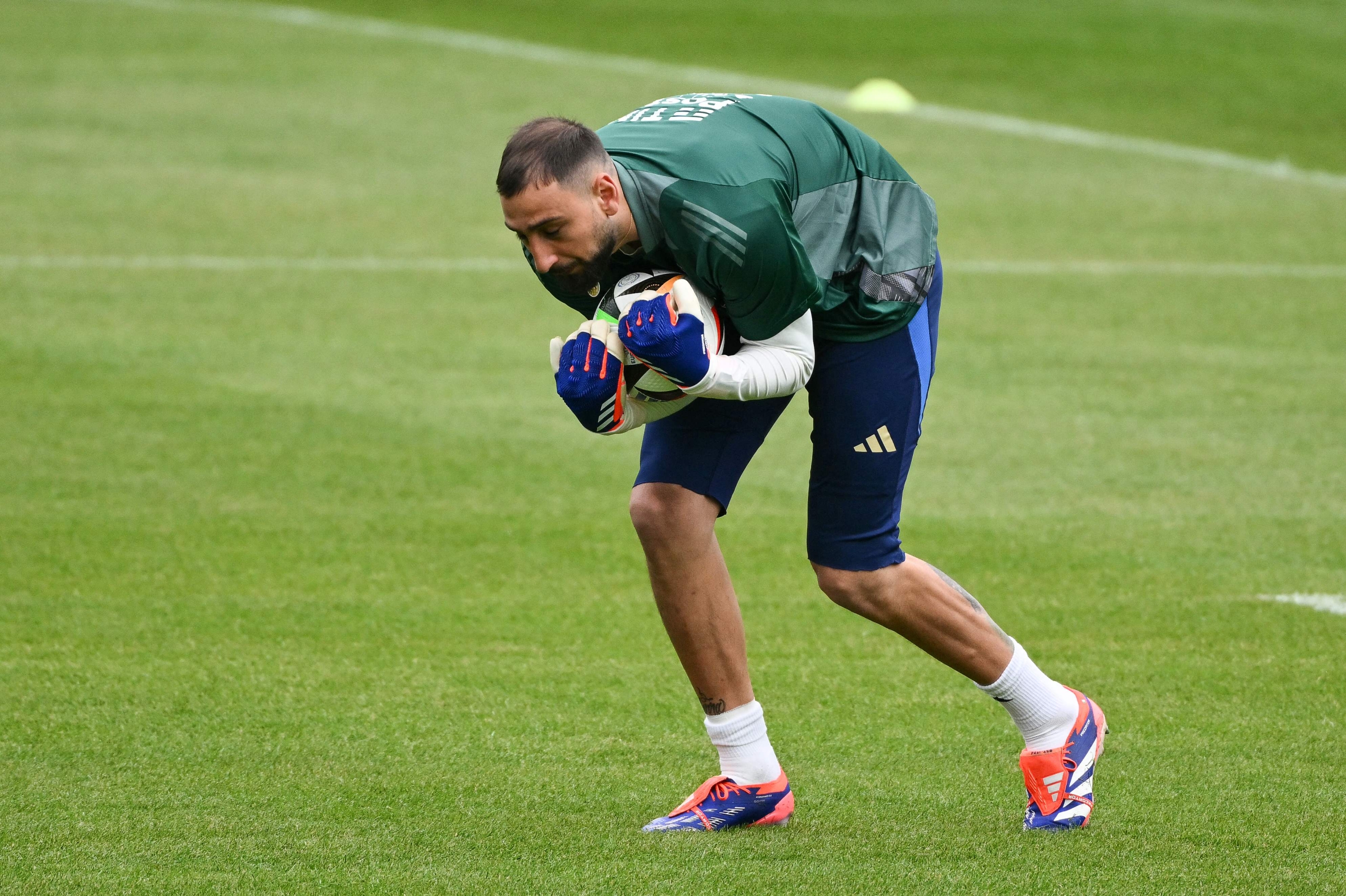 Italys goalkeeper #1 Gianluigi Donnarumma takes part in a training sesssion of Italy's national football team ahead of the UEFA Euro 2024 football Championship in Iserlohn, on June 12, 2024. (Photo by Alberto PIZZOLI / AFP)