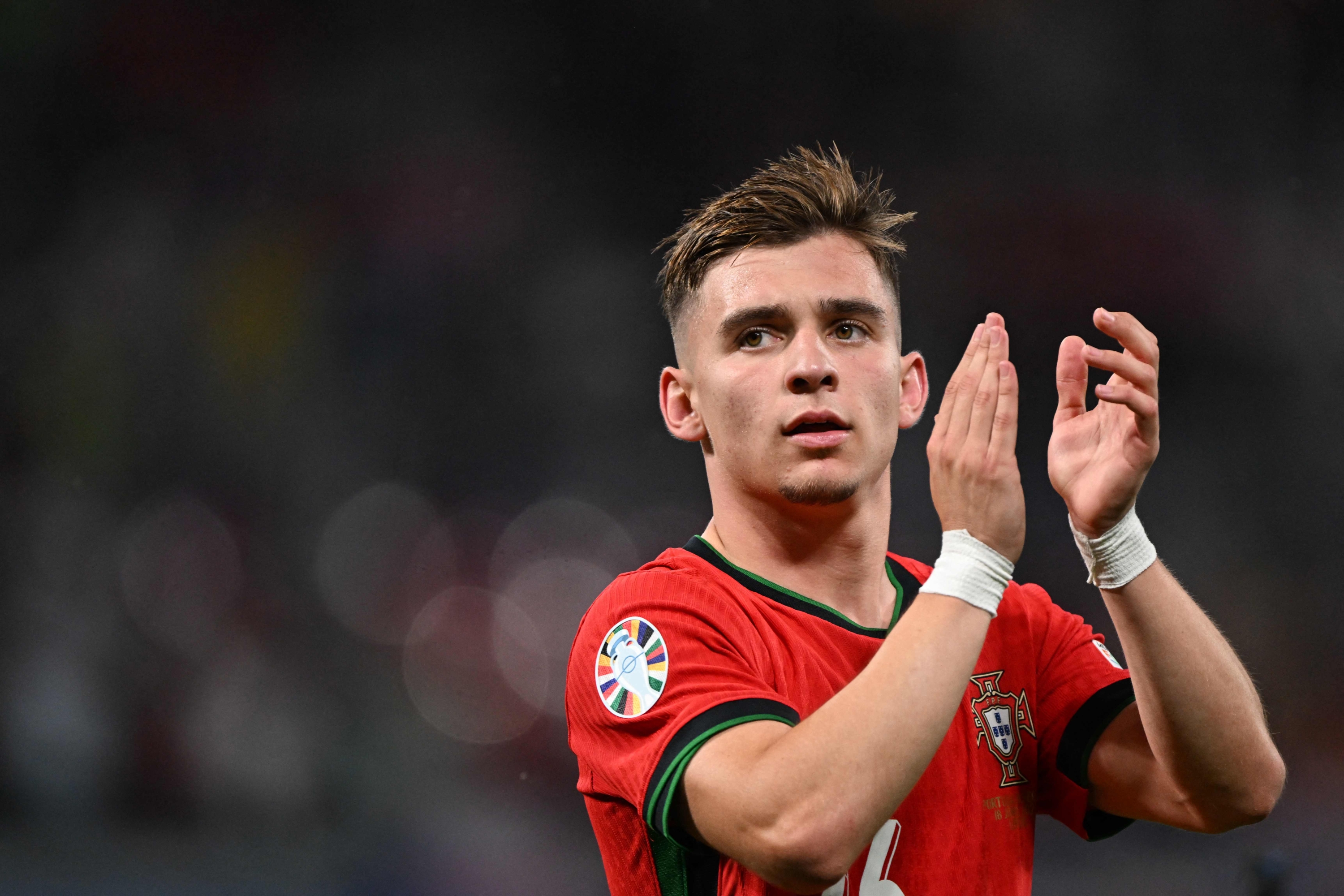 Portugal's forward #26 Francisco Conceicao celebrates on the pitch after the UEFA Euro 2024 Group F football match between Portugal and the Czech Republic at the Leipzig Stadium in Leipzig on June 18, 2024. (Photo by PATRICIA DE MELO MOREIRA / AFP)