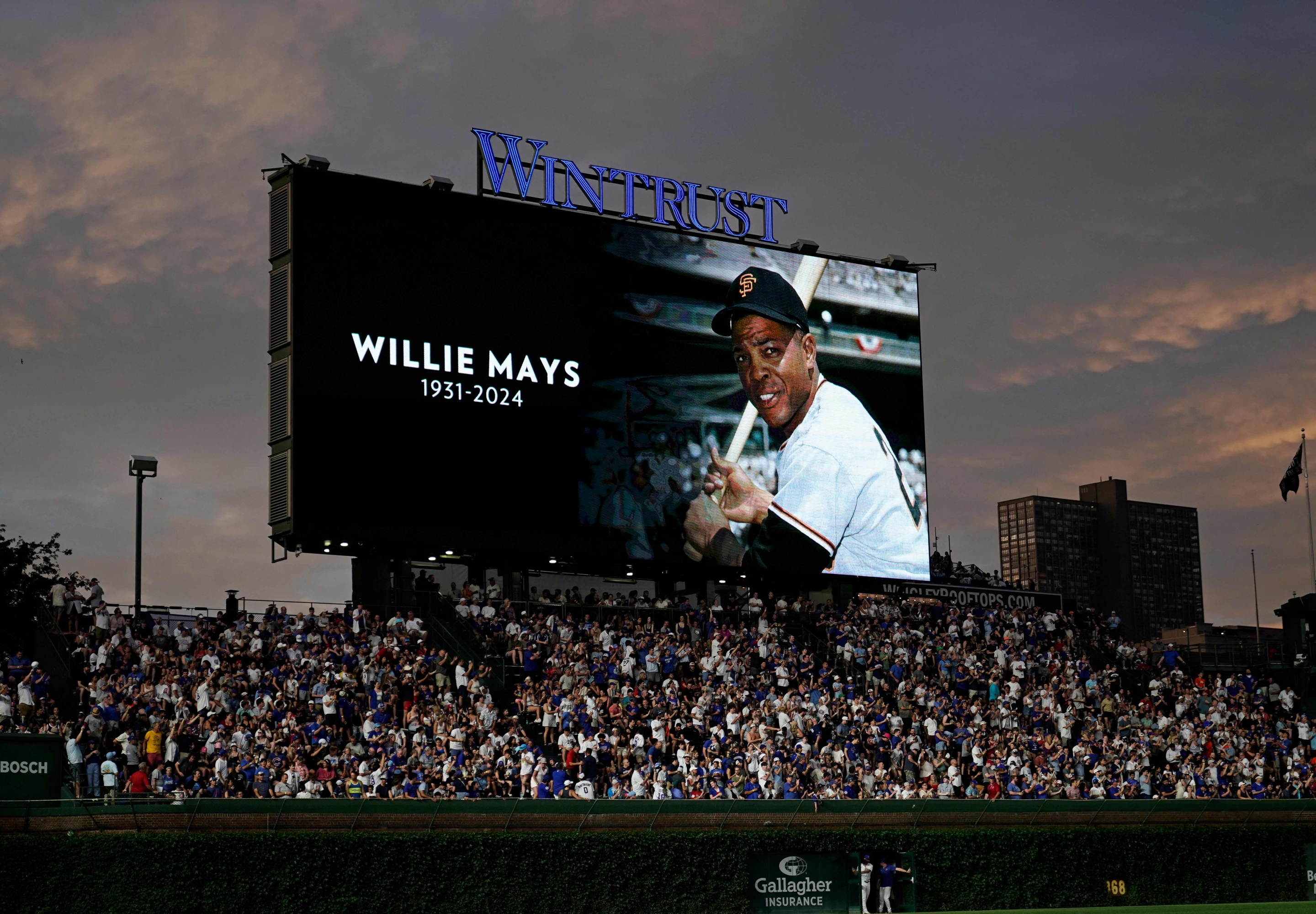 CHICAGO, ILLINOIS - JUNE 18: An image of Willie Mays is displayed on the video board while everyone observed a moment of silence during the sixth inning of a game between the Chicago Cubs and the San Francisco Giants at Wrigley Field on June 18, 2024 in Chicago, Illinois. The Cubs defeated the Giants 5-2.   Nuccio DiNuzzo/Getty Images/AFP (Photo by NUCCIO DINUZZO / GETTY IMAGES NORTH AMERICA / Getty Images via AFP)