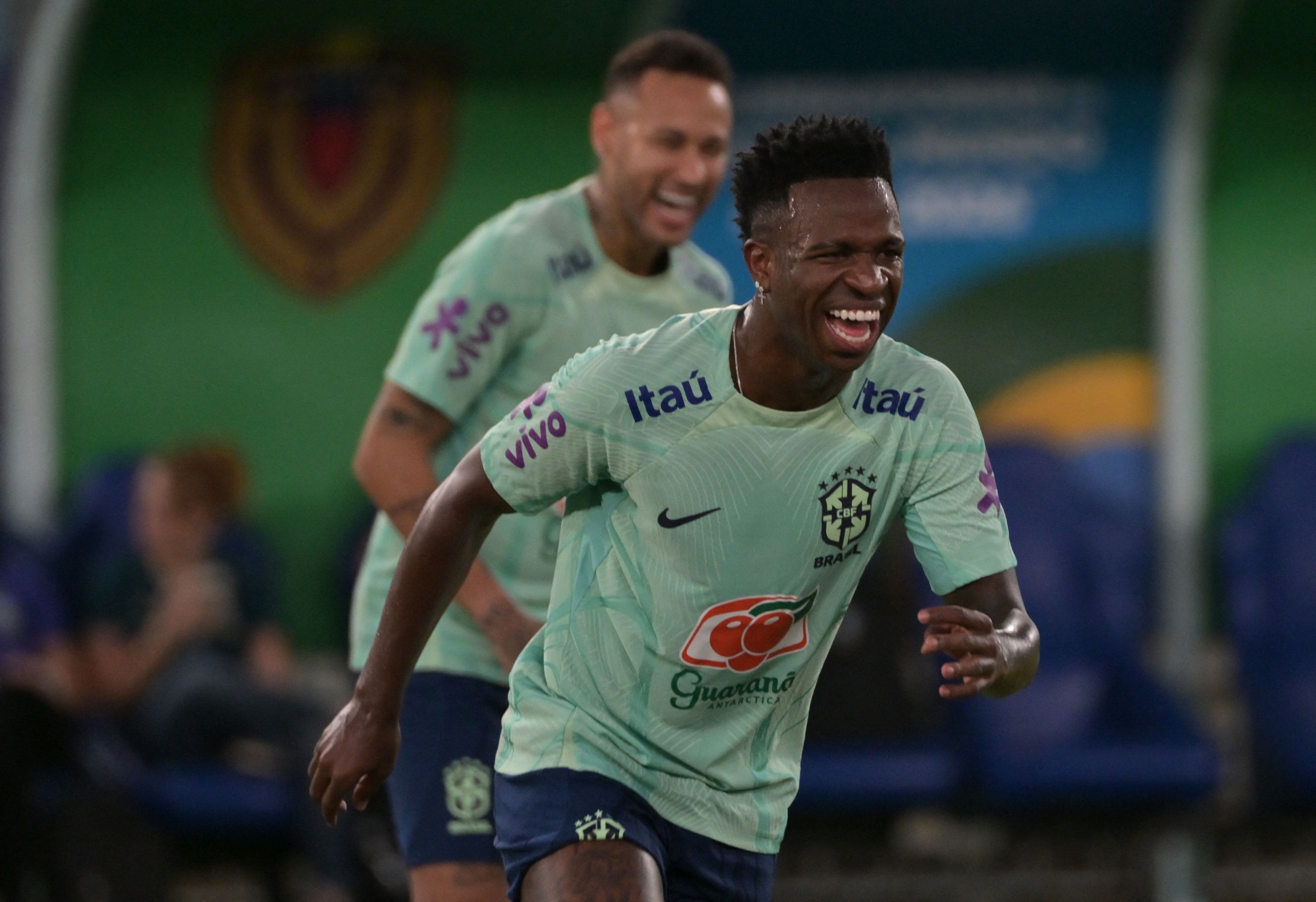 (FILES) Brazil's forward Vinicius Jr (R) and Brazil's forward Neymar take part in a training session of the national team at the Arena Pantanal stadium in Cuiaba, Brazil, on October 11, 2023, ahead of FIFA World Cup 2026 qualifier football matches against Venezuela and Uruguay. Without injured Neymar, their best player in recent years, but with a rising Vinícius Jr in the running for the Ballon d'Or, Brazil is looking to make a splash at the Copa America in the United States to put recent bitter memories behind them. (Photo by NELSON ALMEIDA / AFP)