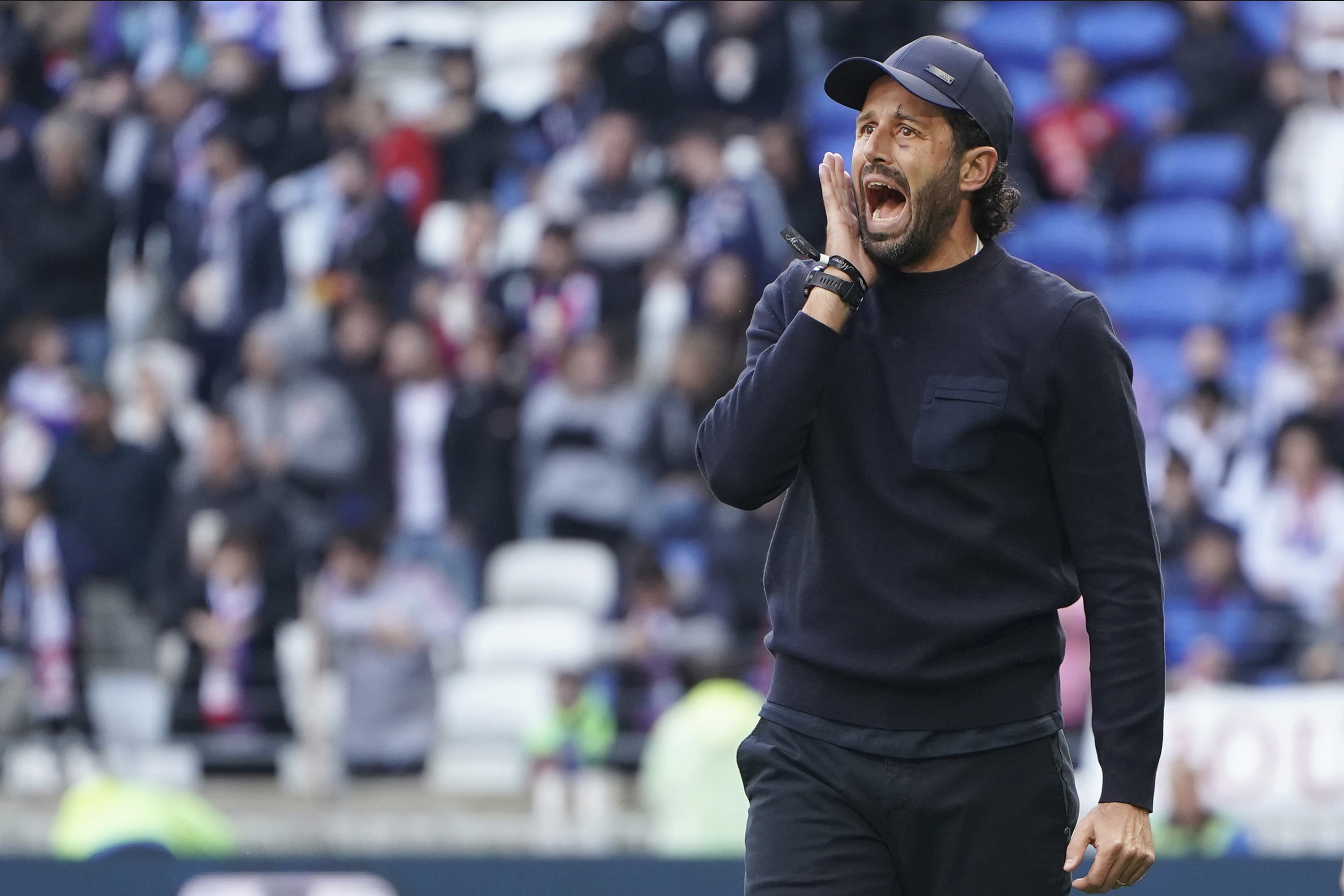 Lyon's head coach Fabio Grosso shouts during the French League One soccer match between Lyon and Metz in Decines, near Lyon, central France, Sunday, Nov. 5, 2023. (AP Photo/Laurent Cipriani)