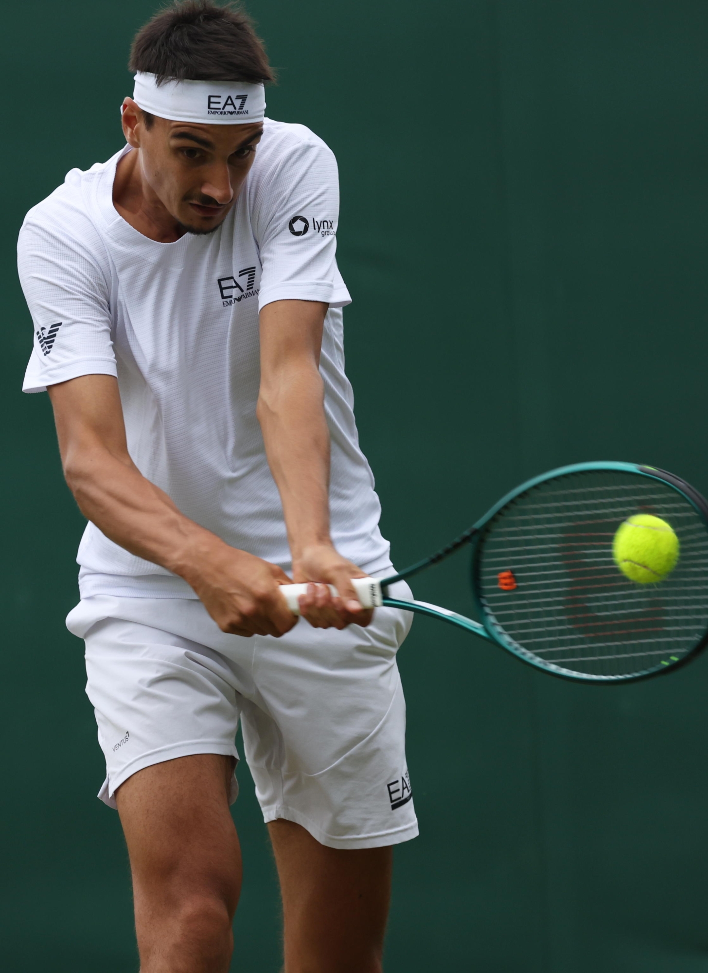epa11455504 Lorenzo Sonego of Italy in action against Roberto Bautista Agut of Spain during their Mens Singles 2nd round match at the Wimbledon Championships, Wimbledon, Britain, 03 July 2024.  EPA/TIM IRELAND  EDITORIAL USE ONLY