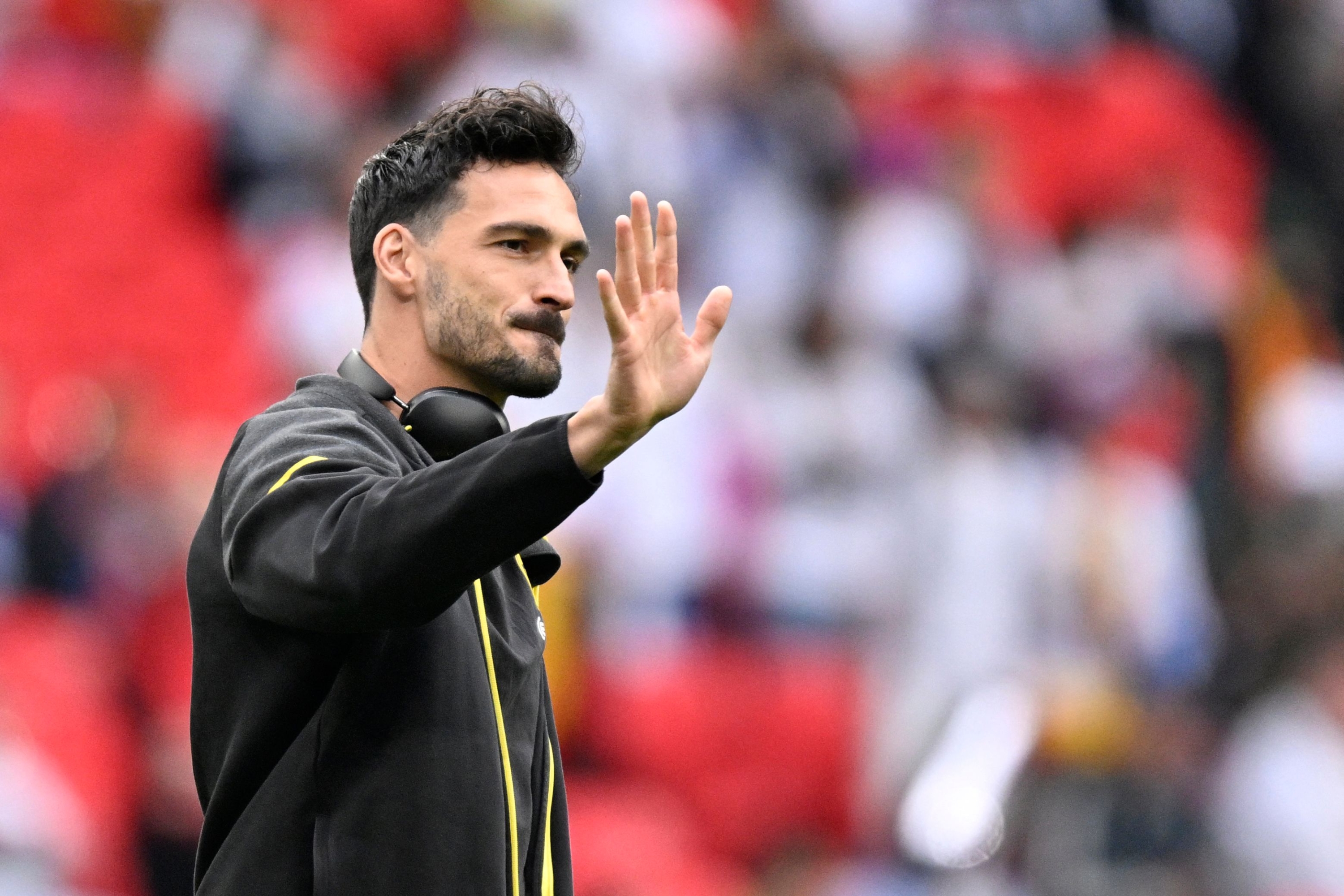 (FILES) Dortmund's German defender #15 Mats Hummels waves ahead of the UEFA Champions League final football match between Borussia Dortmund and Real Madrid, at Wembley stadium, in London, on June 1, 2024. Borussia Dortmund announced on June 14, 2024 defender Mats Hummels will leave after 13 years at the club. (Photo by INA FASSBENDER / AFP)