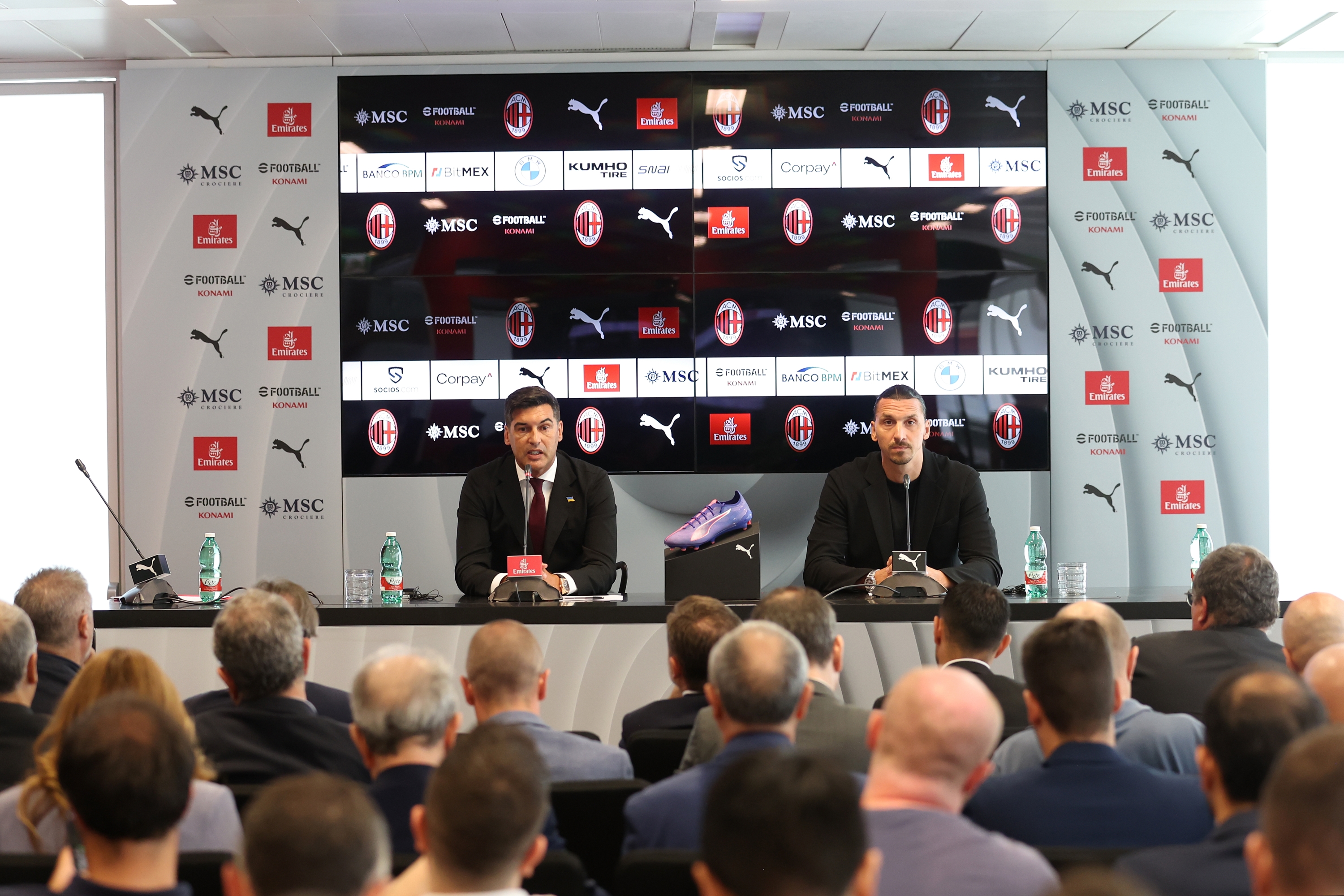 CAIRATE, ITALY - JULY 08: Paulo Fonseca (L) Head coach of AC Milan and Zlatan Ibrahimovic (R) AC Milan Senior Advisor looks on during the AC Milan Press Conference at Casa Milan on July 08, 2024 in Milano, Italy. (Photo by Giuseppe Cottini/AC Milan via Getty Images)