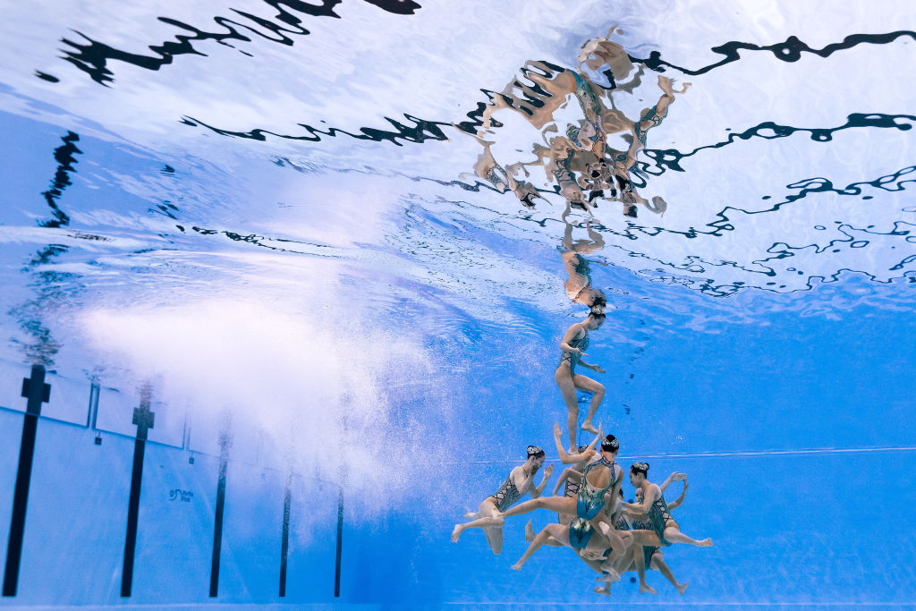 DOHA, QATAR - FEBRUARY 09: (EDITORS NOTE: Image taken using an underwater remote camera.) Hao Chang, Ciyue Wang, Wentao Cheng, Binxuan Xiang, Yu Feng, Yanning Xiao, Xiuchen Li and Yayi Zhang of Team China compete in the Mixed Team Free Final on day eight of the Doha 2024 World Aquatics Championships at Aspire Dome on February 09, 2024 in Doha, Qatar. (Photo by Quinn Rooney/Getty Images)