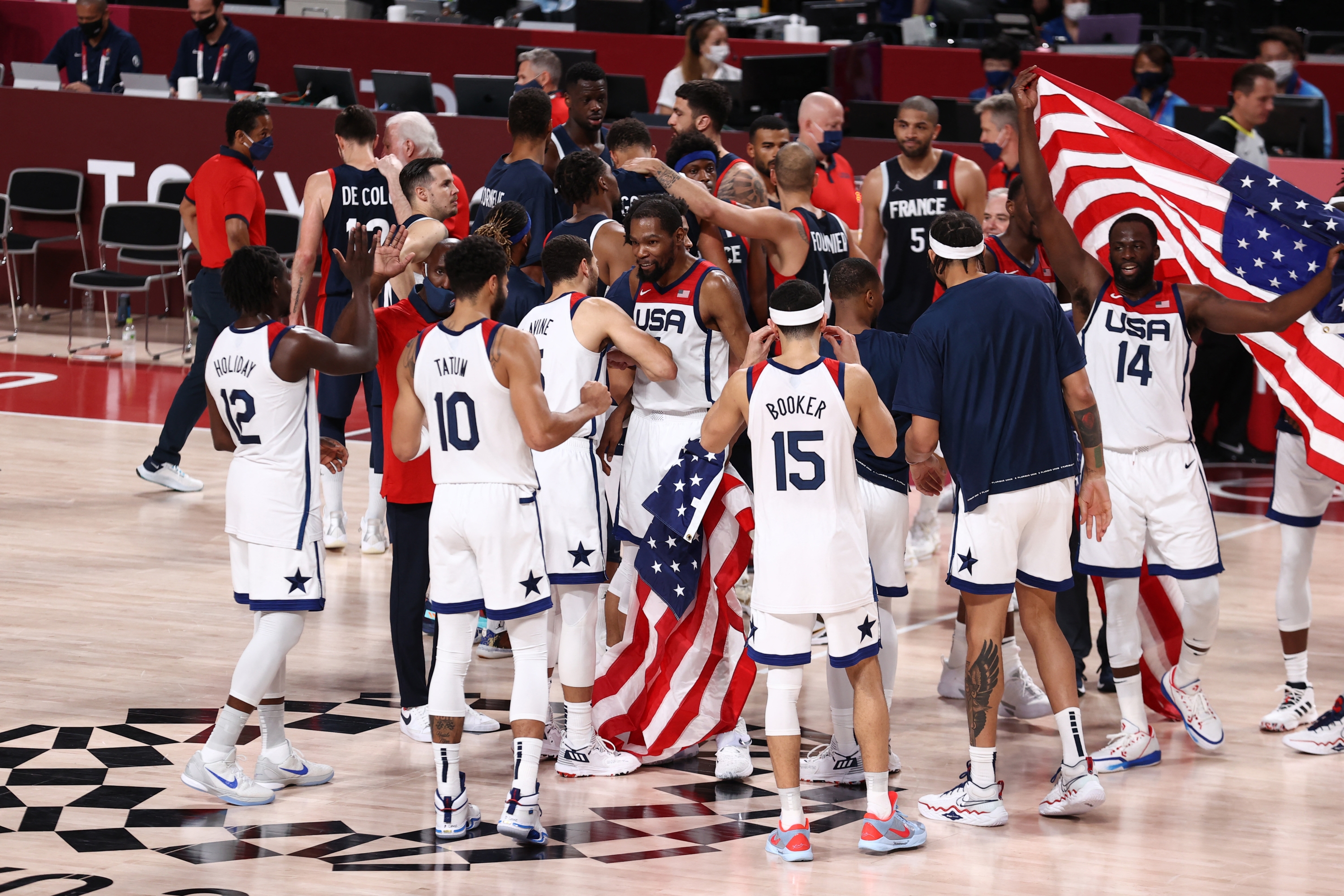 TOKYO, JAPAN -  AUGUST 7: The USA Men's National Team celebrates after the game against the France Men's National Team during the Gold Medal Game of the 2020 Tokyo Olympics on August 7, 2021 at the Super Saitama Arena in Tokyo, Japan. NOTE TO USER: User expressly acknowledges and agrees that, by downloading and or using this Photograph, user is consenting to the terms and conditions of the Getty Images License Agreement. Mandatory Copyright Notice: Copyright 2021 NBAE   Stephen Gosling/NBAE via Getty Images/AFP (Photo by Stephen Gosling / NBAE / Getty Images / Getty Images via AFP)