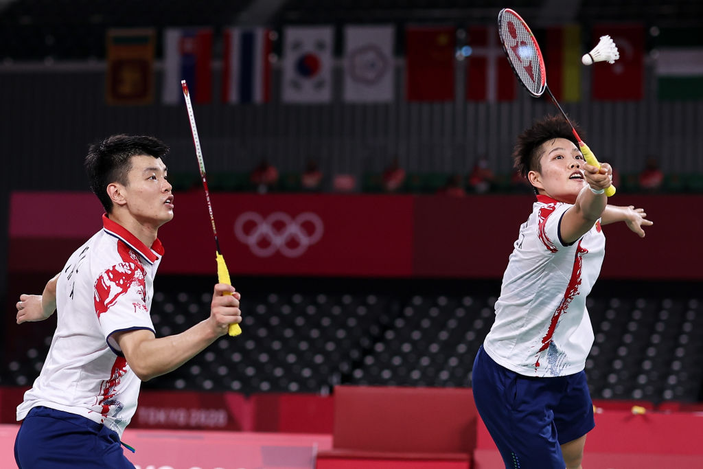 CHOFU, JAPAN - JULY 30: Wang Yi Lyu and Huang Dong Ping(right) of Team China compete against Zheng Si Wei and Huang Ya Qiong of Team China during the Mix Doubles Gold Medal match on day seven of the Tokyo 2020 Olympic Games at Musashino Forest Sport Plaza on July 30, 2021 in Chofu, Tokyo, Japan. (Photo by Lintao Zhang/Getty Images)