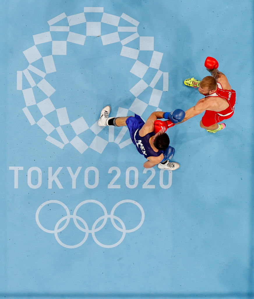 TOKYO, JAPAN - JULY 28: Luka Plantic (red) of Croatia exchanges punches with Rogelio Romero Torres of Mexico during the Men's Light Heavy (75-81kg) on day five of the Tokyo 2020 Olympic Games at Kokugikan Arena on July 28, 2021 in Tokyo, Japan. (Photo by Ueslei Marcelino - Pool/Pool)