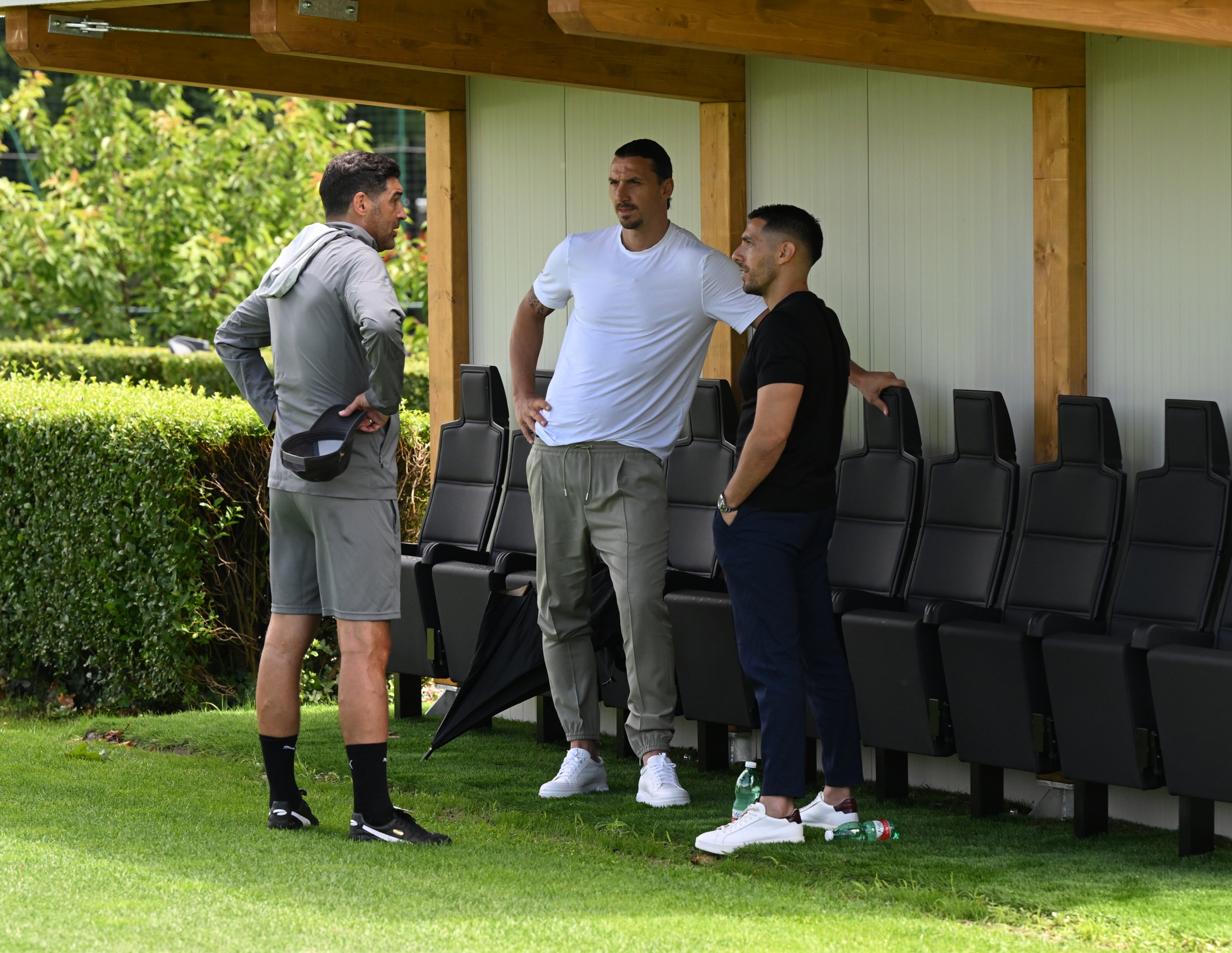 CAIRATE, ITALY - JULY 12: Head coach AC Milan Paulo Fonseca, AC Milan Senior Advisor to Ownership Zlatan Ibrahimovic and AC Milan chief scout Geoffrey Moncada look on during the AC Milan training session at Milanello on July 12, 2024 in Cairate, Italy. (Photo by Claudio Villa/AC Milan via Getty Images)