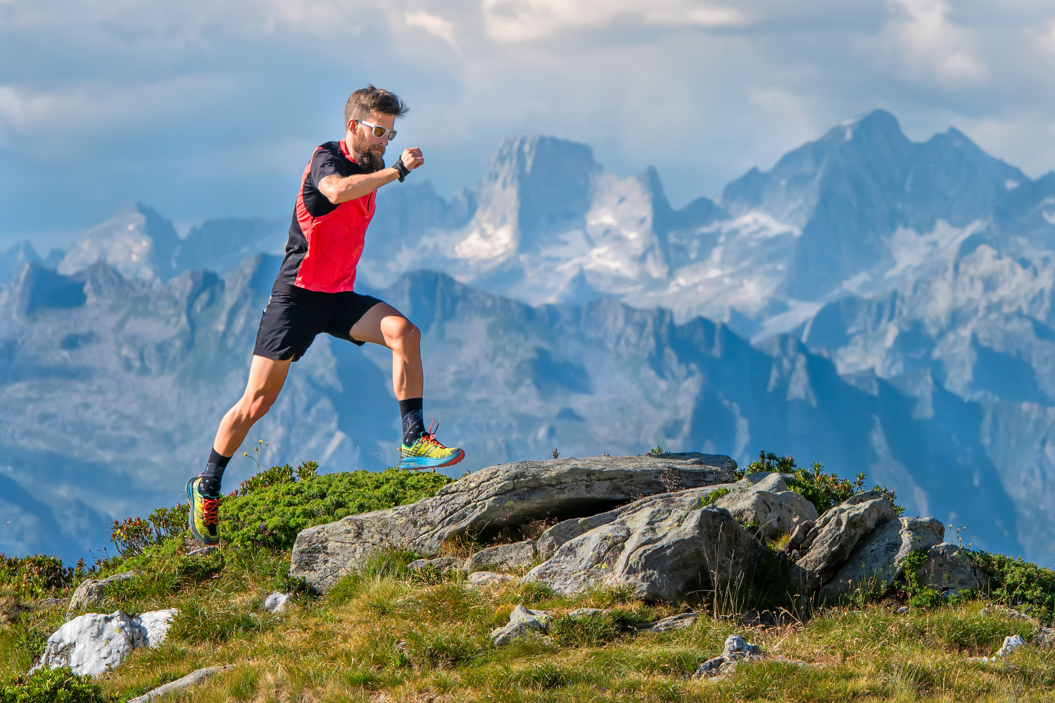 A skyrunner athlete man trains in the high mountains.