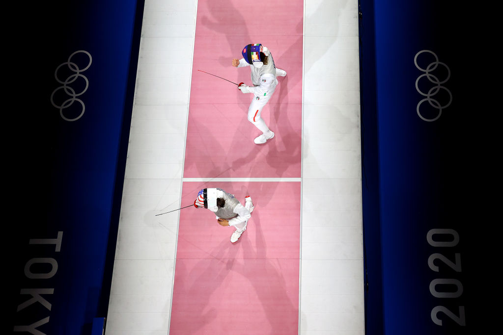 CHIBA, JAPAN - JULY 29: Arianna Errigo of Team Italy (top) celebrates a point against Lee Kiefer of Team United States (bottom) during the Women's Foil Team Bronze Medal Match on day six of the Tokyo 2020 Olympic Games at Makuhari Messe Hall on July 29, 2021 in Chiba, Japan. (Photo by Rob Carr/Getty Images)