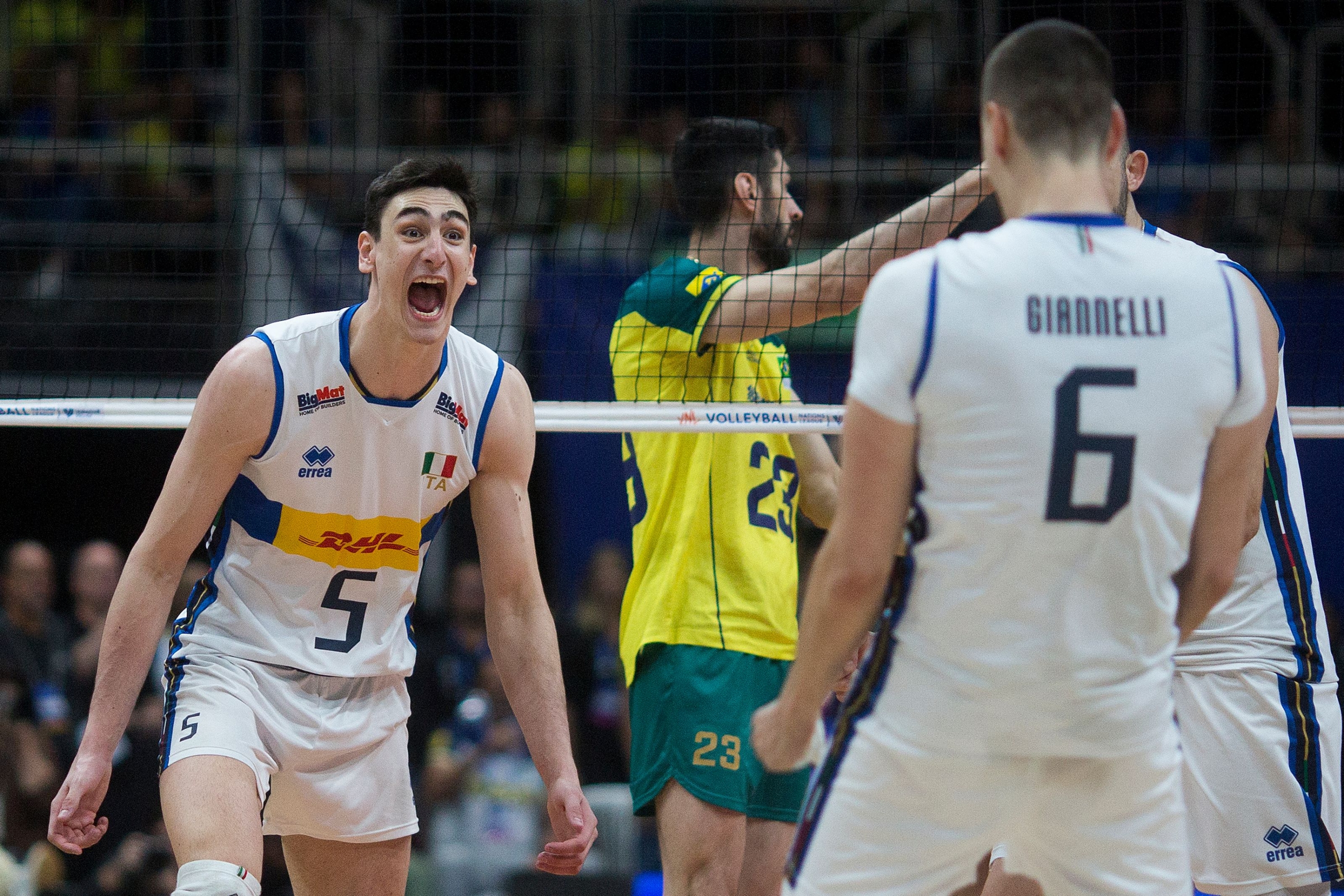 Italy's Alessandro Michieletto (L) and Simone Giannelli celebrate after winning the Men's Volleyball Nations League match between Brazil and Italy at the Maracanazinho gymnasium in Rio de Janeiro on May 26, 2024. (Photo by Daniel RAMALHO / AFP)