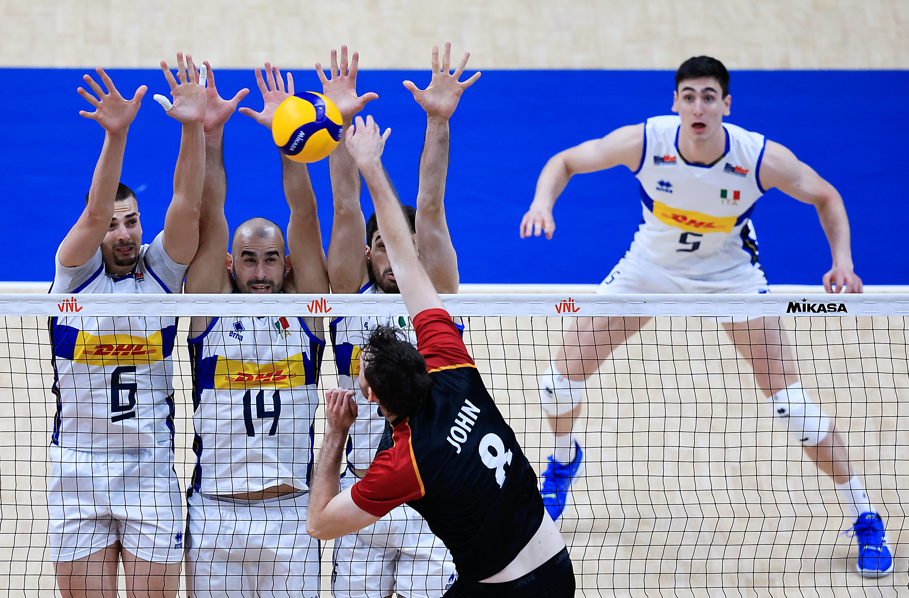 RIO DE JANEIRO, BRAZIL - MAY 22: Filip John of Germany jumps to spike the ball against Simone Giannelli, Gianluca Galassi and Daniele Lavia of Italy during a Pool 2 match between Germany and Italy as part of the Men's Volleyball Nations League at Maracanazinho on May 22, 2024 in Rio de Janeiro, Brazil.  (Photo by Buda Mendes/Getty Images)