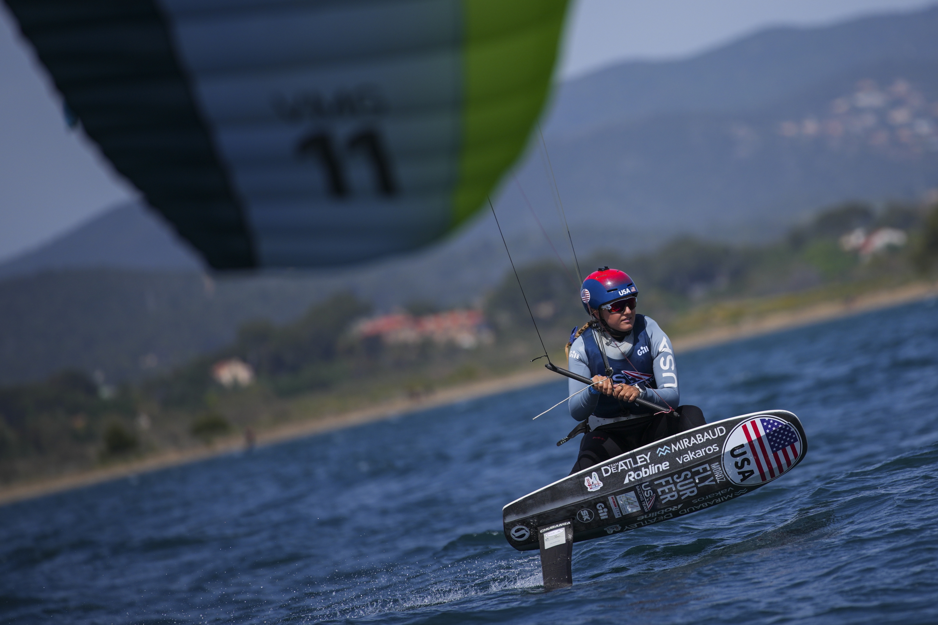 FILE - U.S. Olympic sailing team member Daniela Moroz kiteboards during a training session in Hyeres, southern France, Monday, April 29, 2024. Fans looking for something different at the Olympics might want to check out kitesurfing. But don?t blink ? it?s the fastest sport in the Summer Games. (AP Photo/Daniel Cole, File)