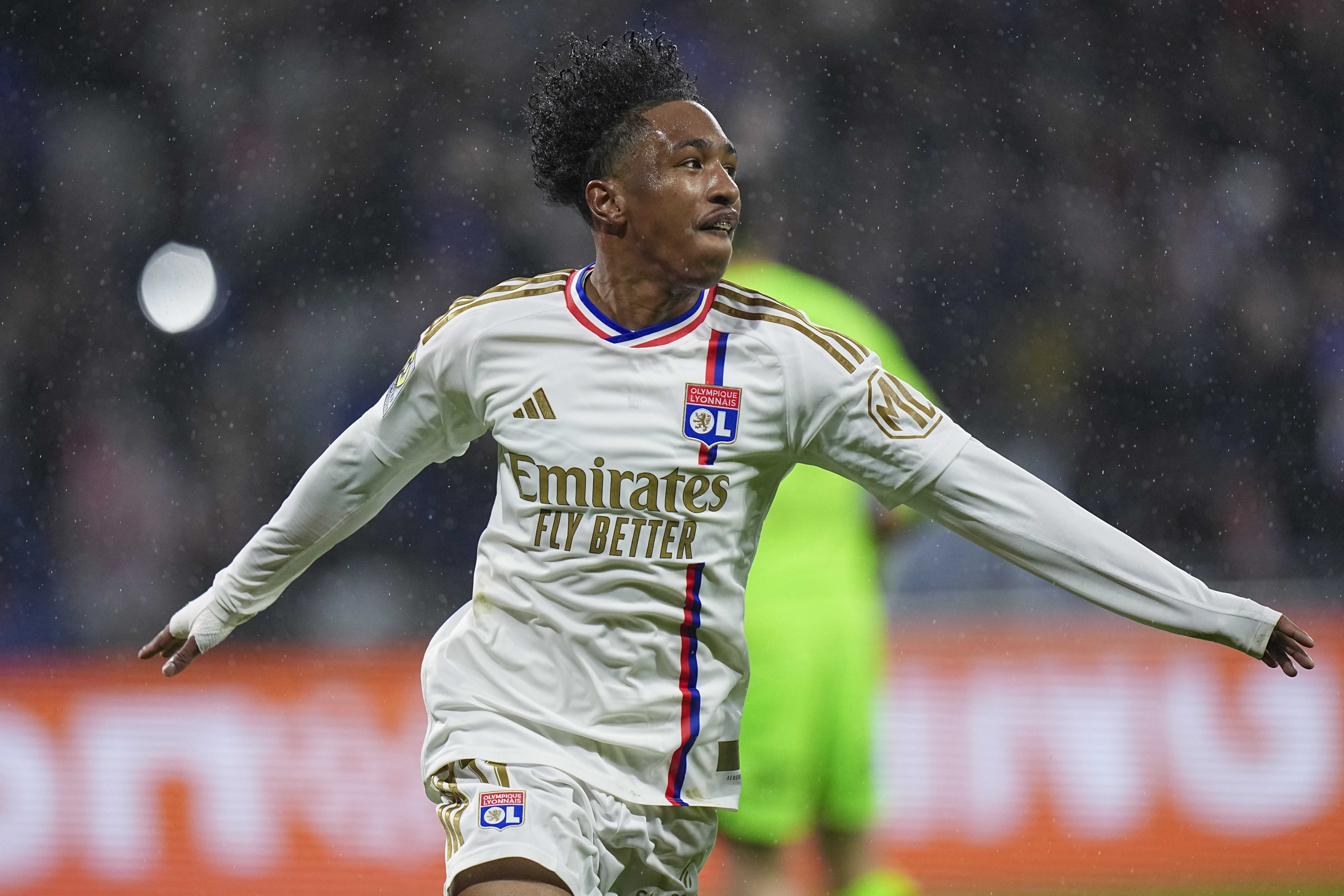 Lyon's Malick Fofana celebrates scoring his side's third goal during a French League One soccer match between Lyon and Monaco at the Groupama stadium in Decines, outside Lyon, France, Sunday, April 28, 2024. (AP Photo/Laurent Cipriani)