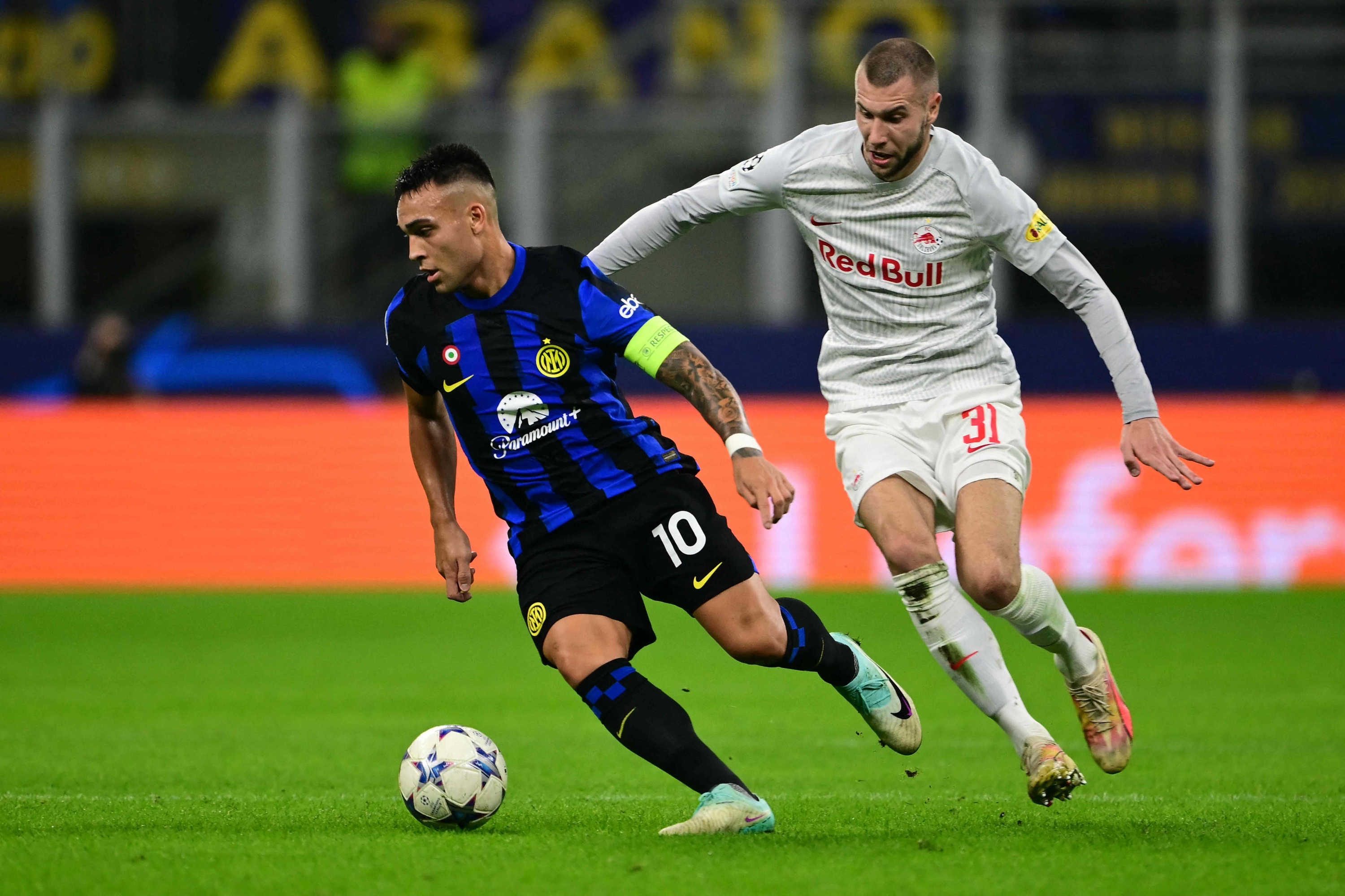 Inter Milan's Argentine forward #10 Lautaro Martinez fights for the ball with Salzburg's Serbian defender #31 Strahinja Pavlovic during the UEFA Champions League 1st round day 3 Group D football match between Inter Milan and Salzburg at the San Siro stadium in Milan on October 24, 2023. (Photo by Marco BERTORELLO / AFP)