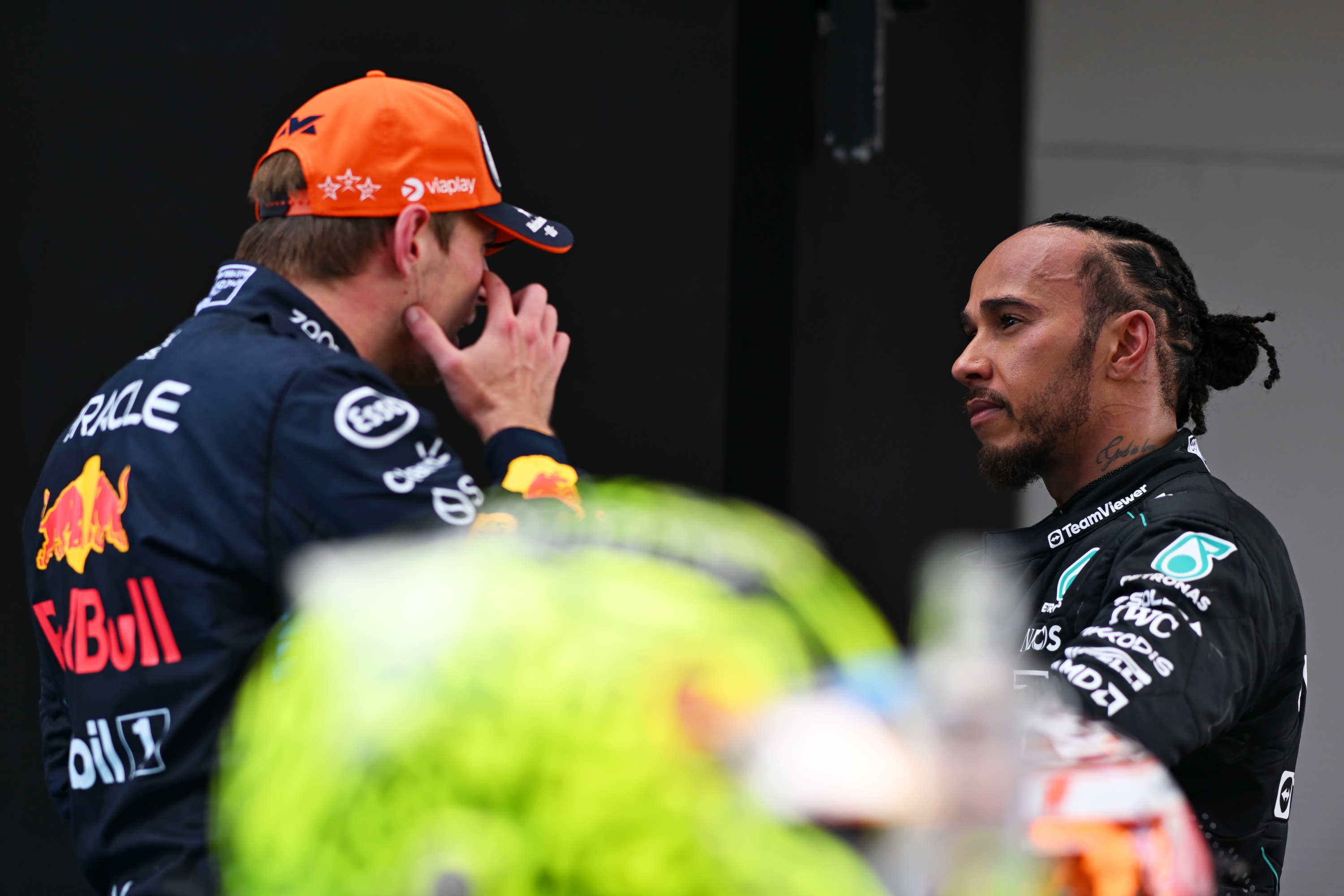 BARCELONA, SPAIN - JUNE 23: Race winner Max Verstappen of the Netherlands and Oracle Red Bull Racing and Third placed Lewis Hamilton of Great Britain and Mercedes celebrate in parc ferme during the F1 Grand Prix of Spain at Circuit de Barcelona-Catalunya on June 23, 2024 in Barcelona, Spain. (Photo by Rudy Carezzevoli/Getty Images)