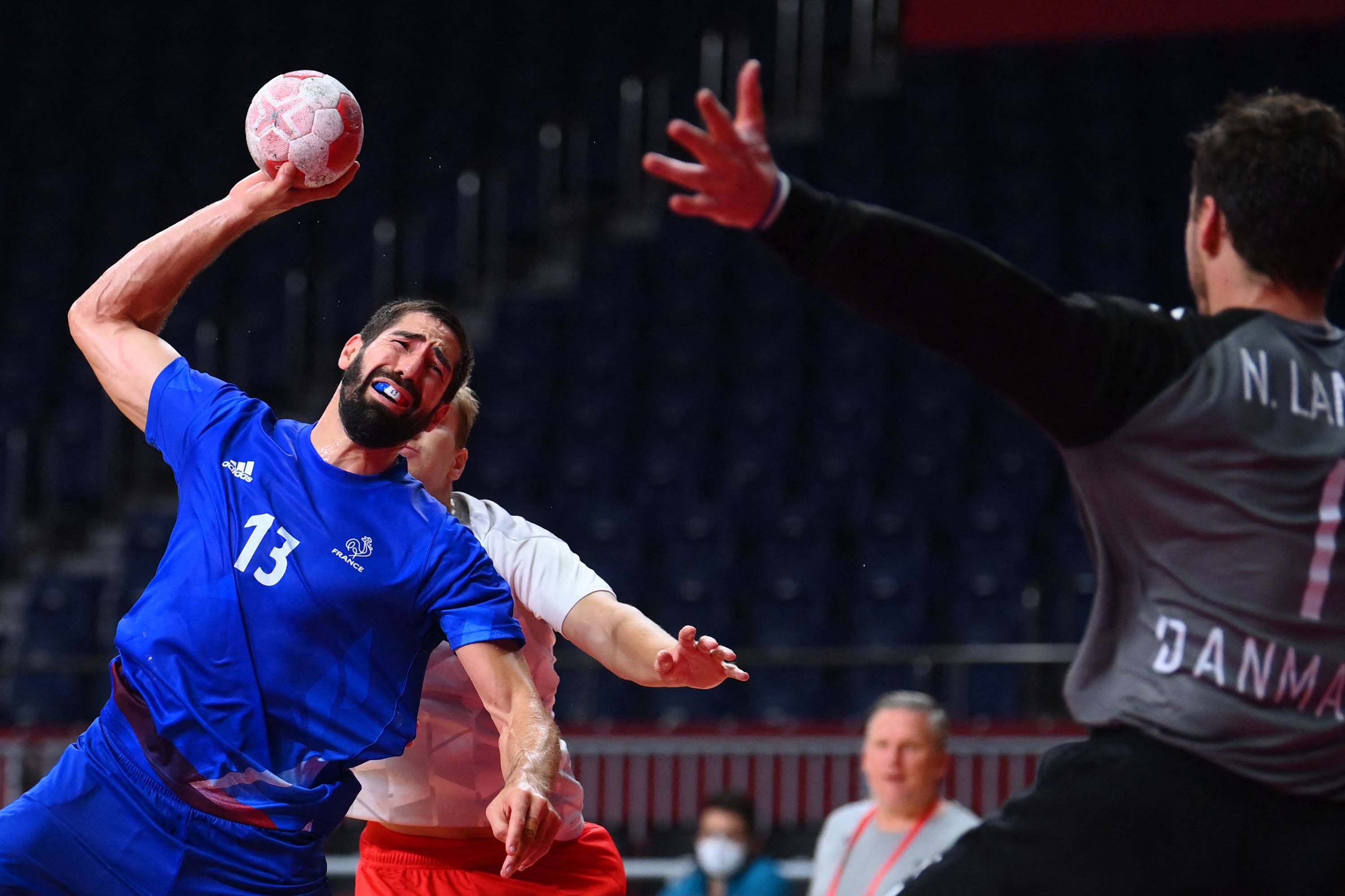 France's centre back Nikola Karabatic shoots and scores a goal during the men's final handball match between France and Denmark of the Tokyo 2020 Olympic Games at the Yoyogi National Stadium in Tokyo on August 7, 2021. (Photo by Franck FIFE / AFP)