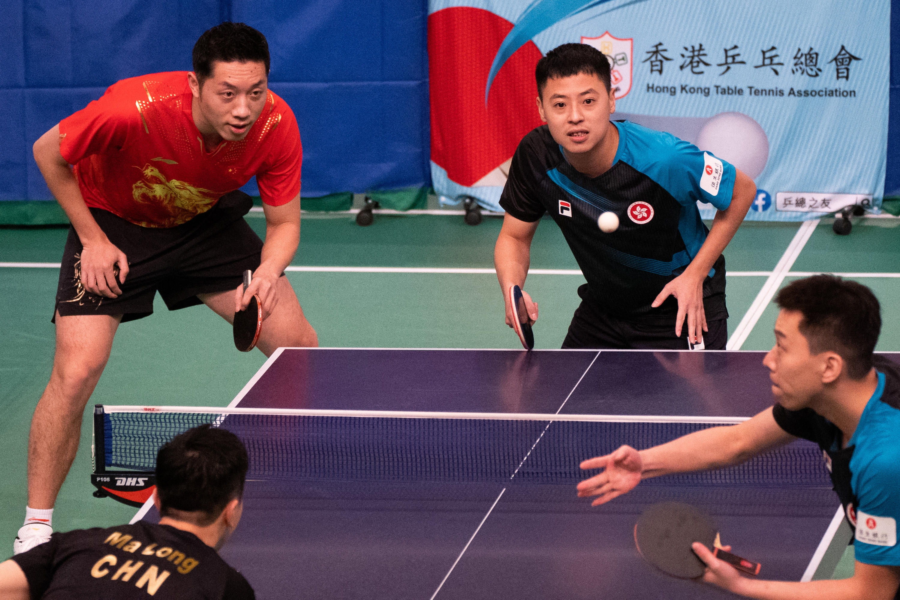 Hong Kong's and Chinese table tennis players perform during the sports demonstration by the Tokyo 2020 Olympic Games Mainland Olympians in Hong Kongs Queen Elizabeth Stadium on December 4, 2021. (Photo by Bertha WANG / AFP)