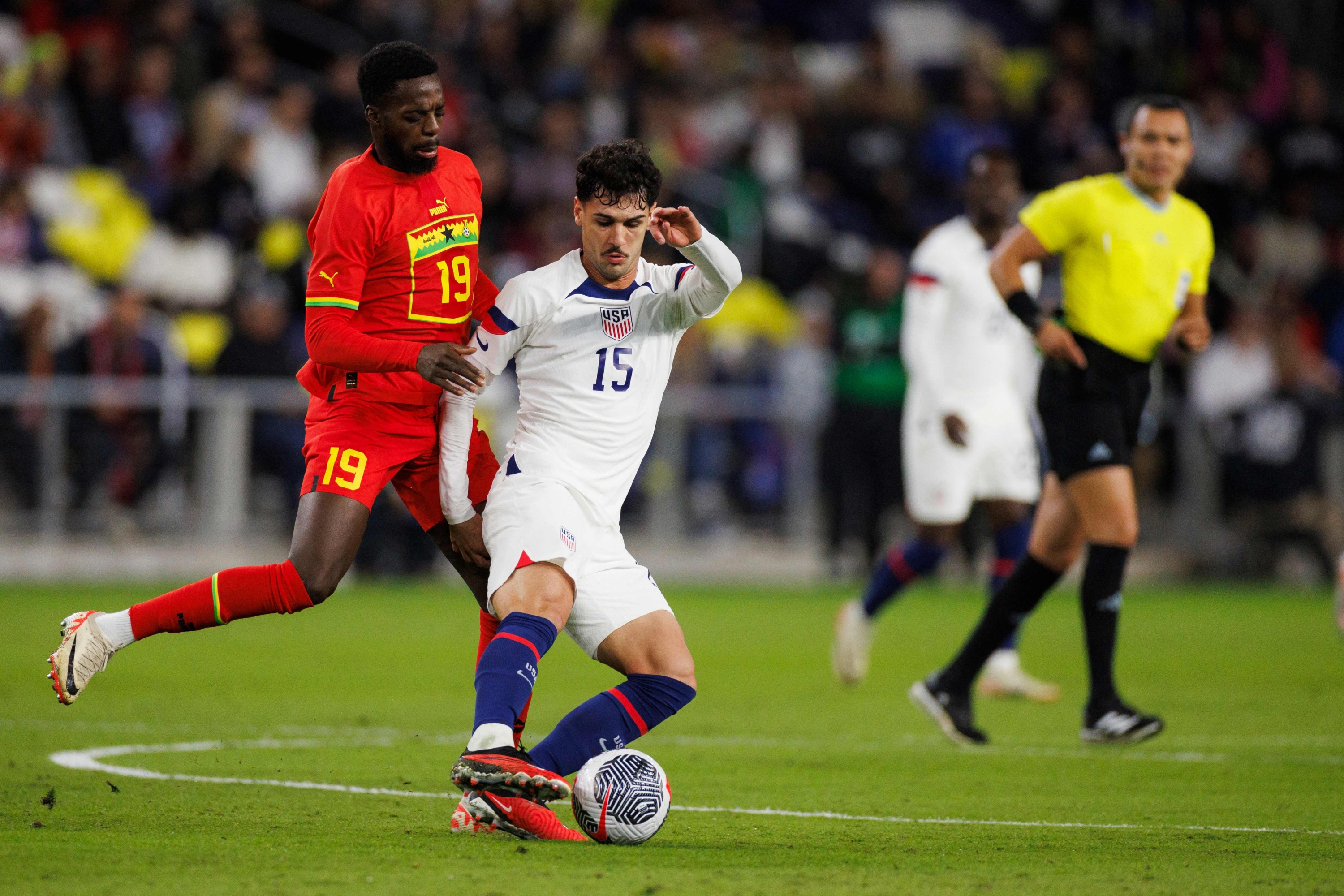 NASHVILLE, TENNESSEE - OCTOBER 17: Iñaki Williams #19 of Ghana challenges Johnny Cardoso #15 of United States during the first half of an international friendly match at GEODIS Park on October 17, 2023 in Nashville, Tennessee.   Brett Carlsen/Getty Images/AFP (Photo by Brett Carlsen / GETTY IMAGES NORTH AMERICA / Getty Images via AFP)