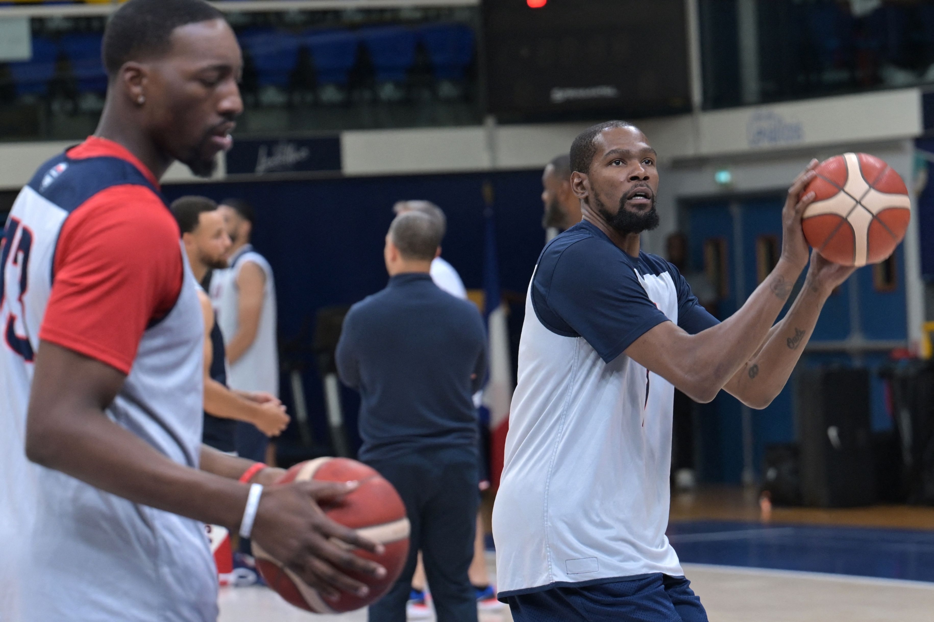 US' Bam Adebayo and Kevin Durant take part in a team training sessions at Palais des sports Marcel-Cerdan in Paris on July 25, 2024, ahead of the Paris 2024 Olympic Games. (Photo by Arun SANKAR / AFP)