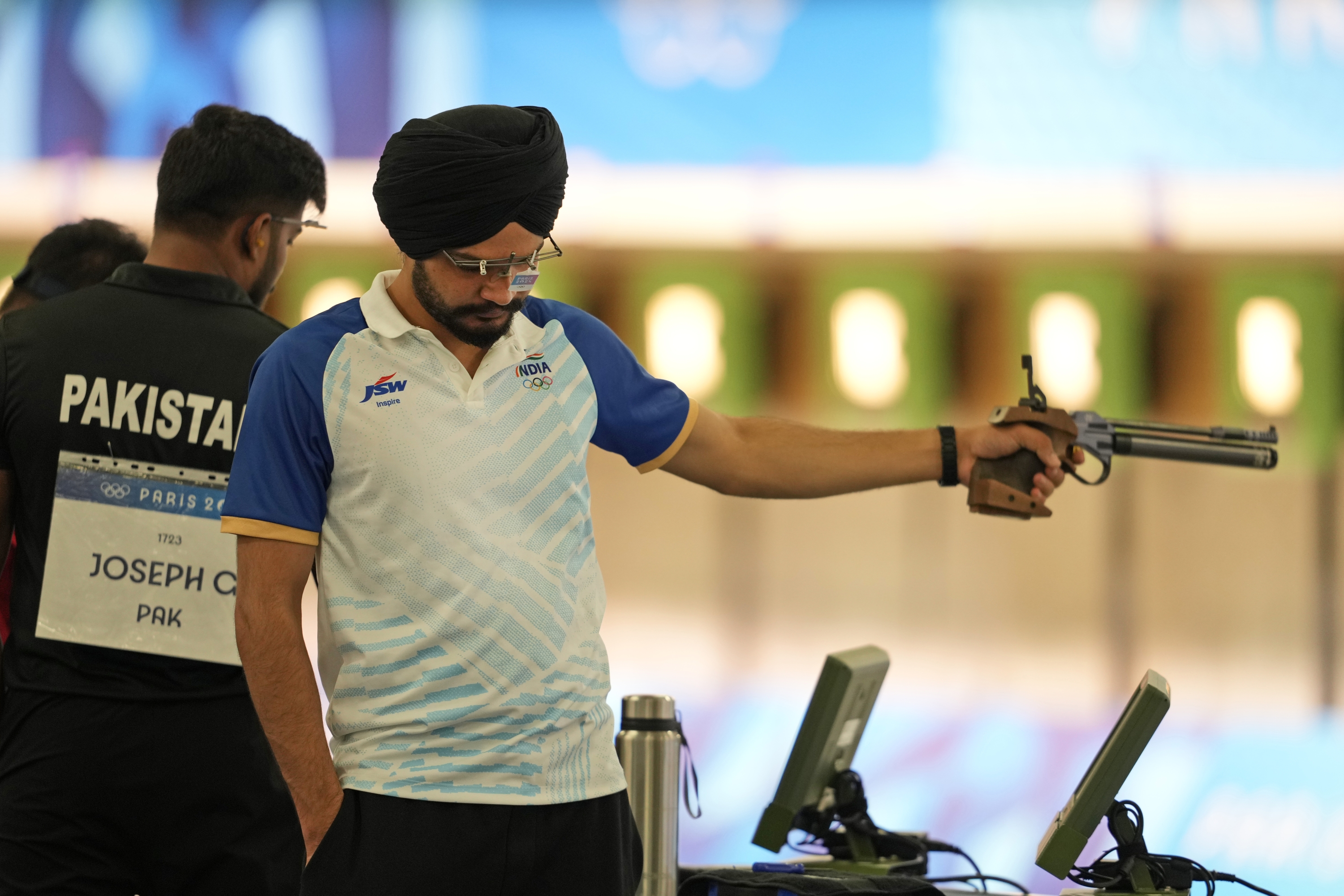 India's Sarabjot Singh participates in the 10m Air Pistol Men Pre-event Training at the 2024 Summer Olympics, Friday, July 26, 2024, in Chateauroux, France. (AP Photo/Manish Swarup)