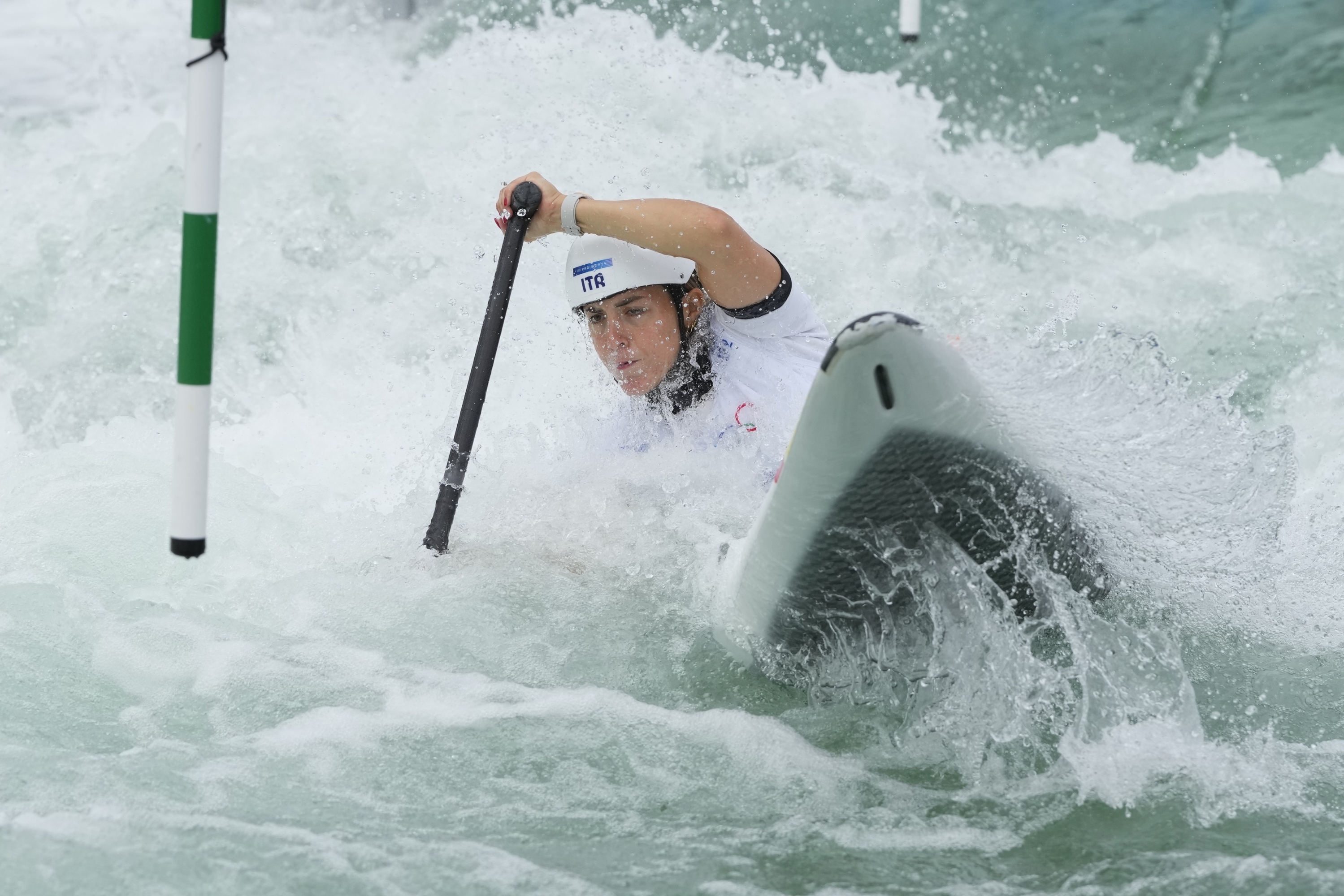 Marta Bertoncelli, of Italy, trains on a canoe slalom course ahead of the 2024 Summer Olympics, Thursday, July 25, 2024, in Vaires-sur-Marne, France. (AP Photo/Kirsty Wigglesworth)