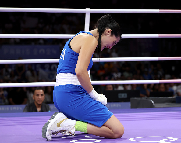 PARIS, FRANCE - AUGUST 01: Angela Carini of Team Italy reacts after abandoning her Women's 66kg preliminary round match against Imane Khelif of Team Algeria in the first round on day six of the Olympic Games Paris 2024 at North Paris Arena on August 01, 2024 in Paris, France. (Photo by Richard Pelham/Getty Images)