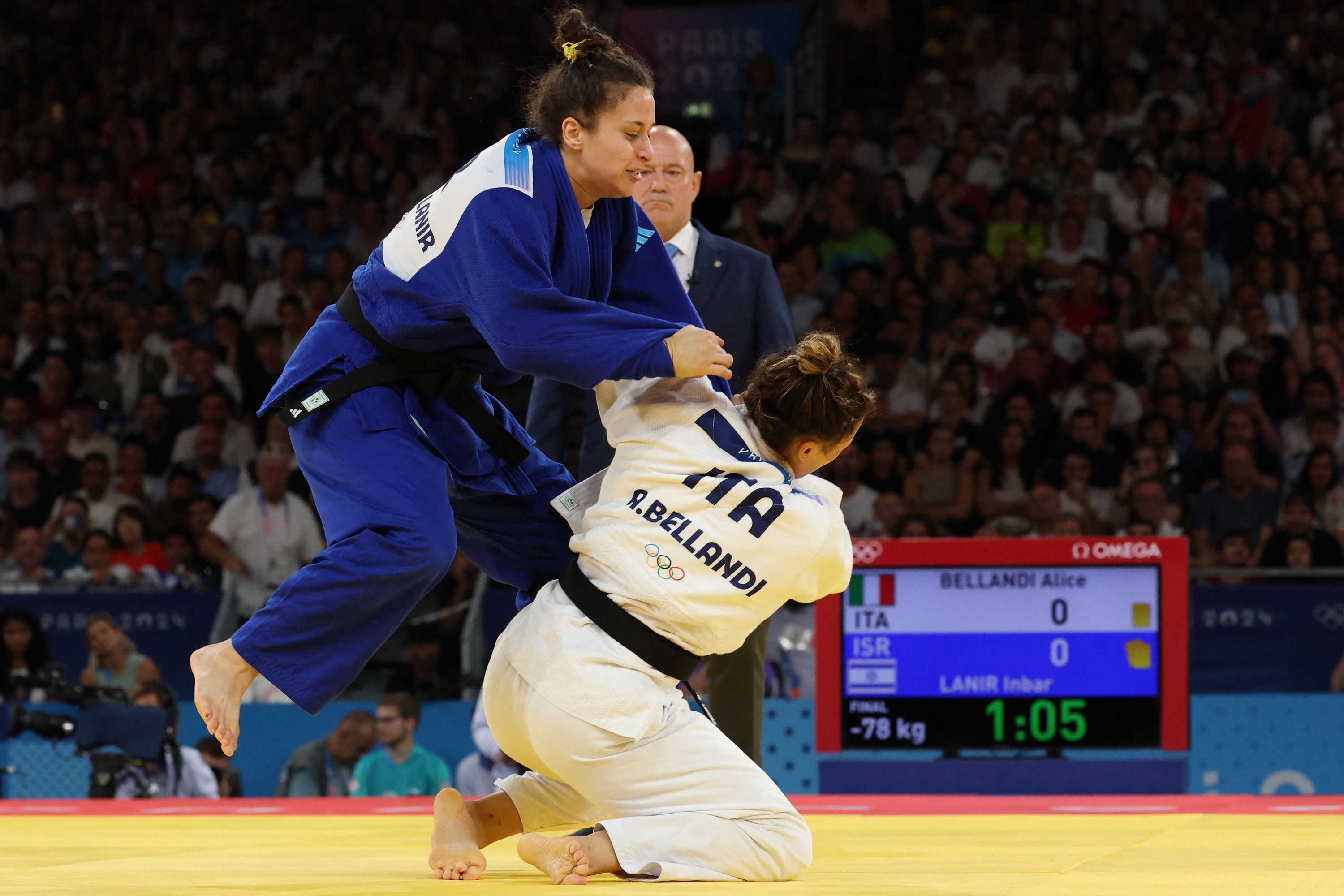 Italy's Alice Bellandi and Israel's Inbar Lanir (Blue) compete in the judo women's -78kg gold medal bout of the Paris 2024 Olympic Games at the Champ-de-Mars Arena, in Paris on August 1, 2024. (Photo by Jack GUEZ / AFP)