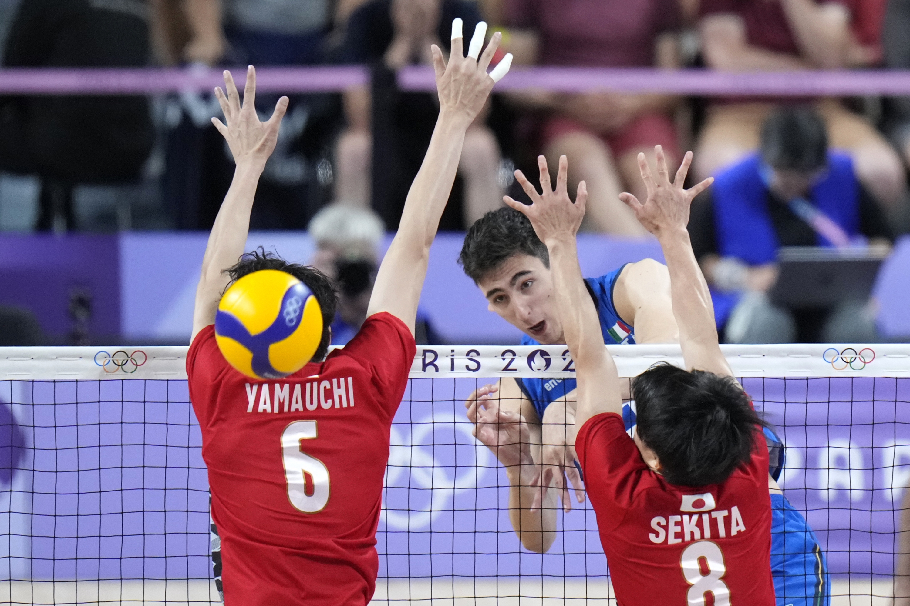 Simone Giannelli, of Italy, spikes a ball during a men's quarter final volleyball match between Italy and Japan at the 2024 Summer Olympics, Monday, Aug. 5, 2024, in Paris, France. (AP Photo/Alessandra Tarantino)