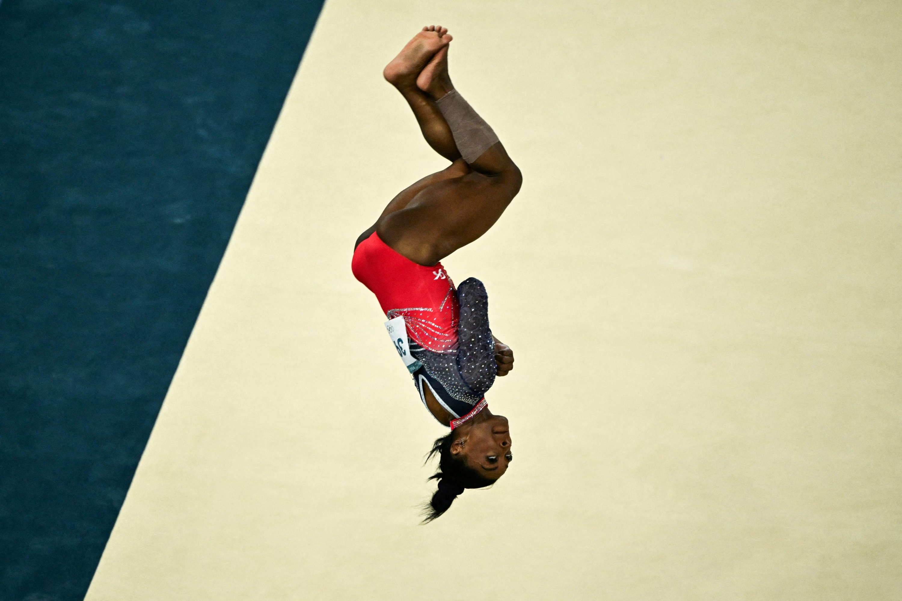 US' Simone Biles competes in the artistic gymnastics women's floor exercise final during the Paris 2024 Olympic Games at the Bercy Arena in Paris, on August 5, 2024. (Photo by Lionel BONAVENTURE / AFP)