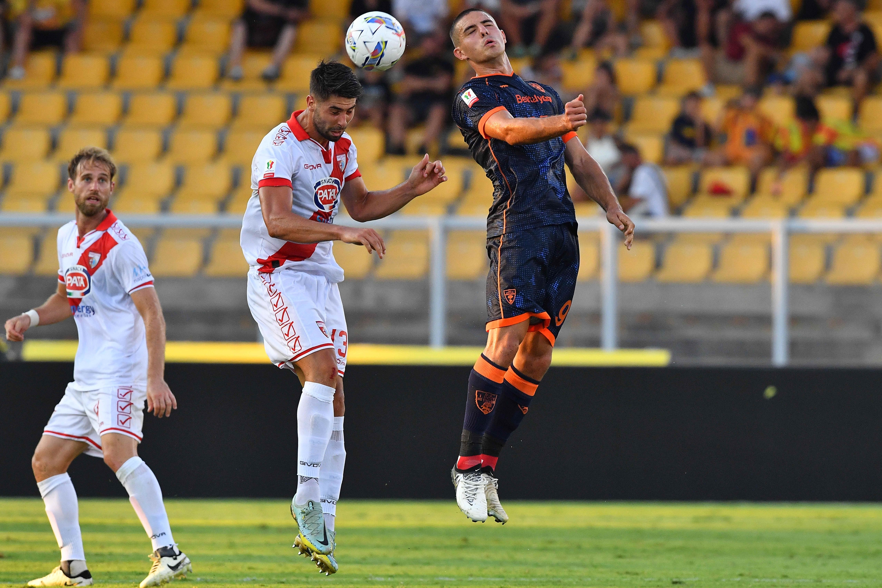 Krstovic and Brignani in action during the thirty-second Frecciarossa Italy Cup soccer match between US Lecce and Mantova 1911 at the Via del Mare Stadium in Lecce, Italy, Monday, August 12, 2024. (Credit Image: © Giovanni Evangelista/LaPresse)