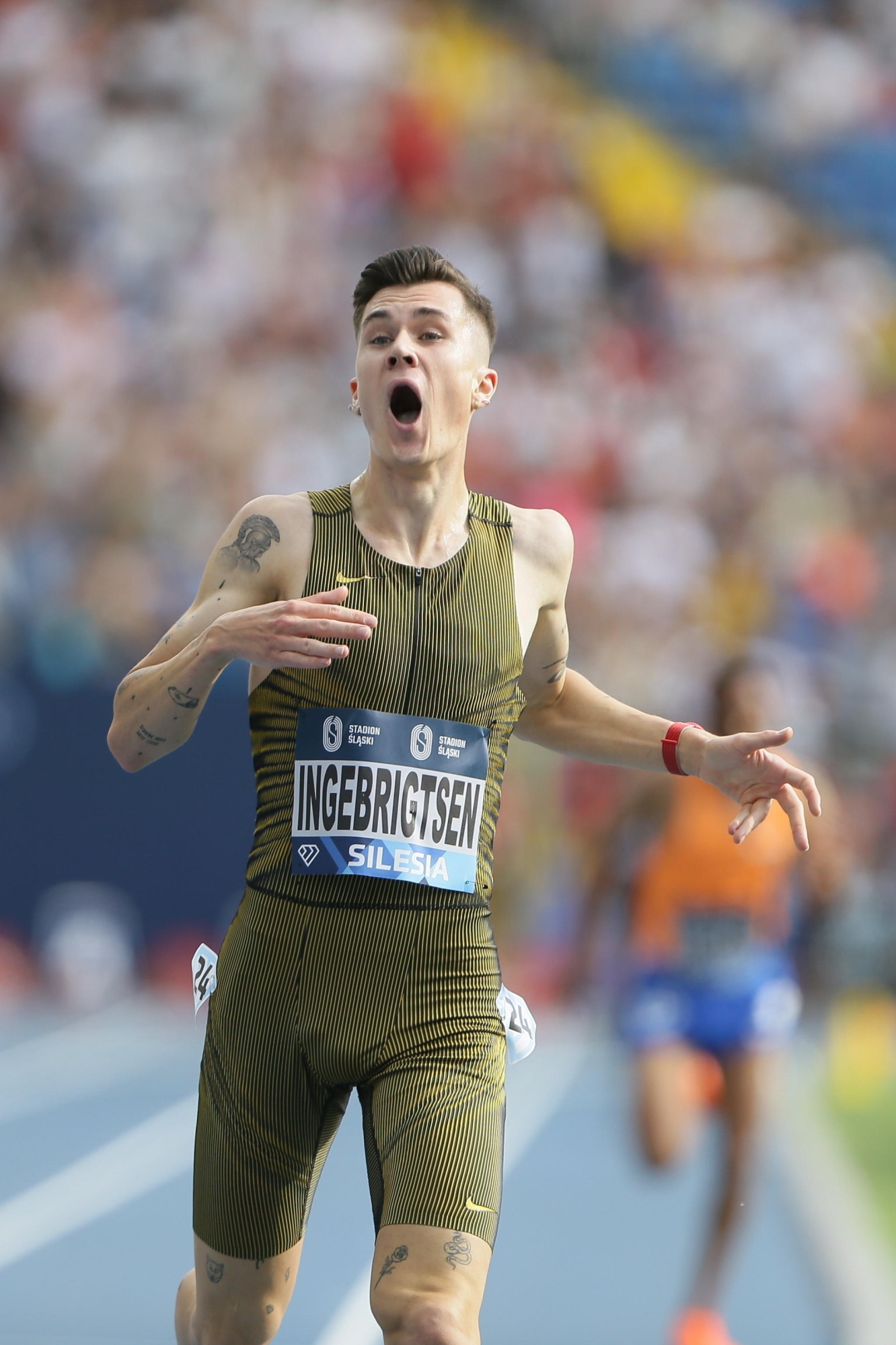 epa11564262 Jakob Ingebrigtsen of Norway celebrates after setting a new World Record of the men's 400m Hurdles event during the Diamond League atletics meeting - Kamila Skolimowska Memorial, at the Silesian Stadium in Chorzow, southern Poland, 25 August 2024.  EPA/Jarek Praszkiewicz POLAND OUT