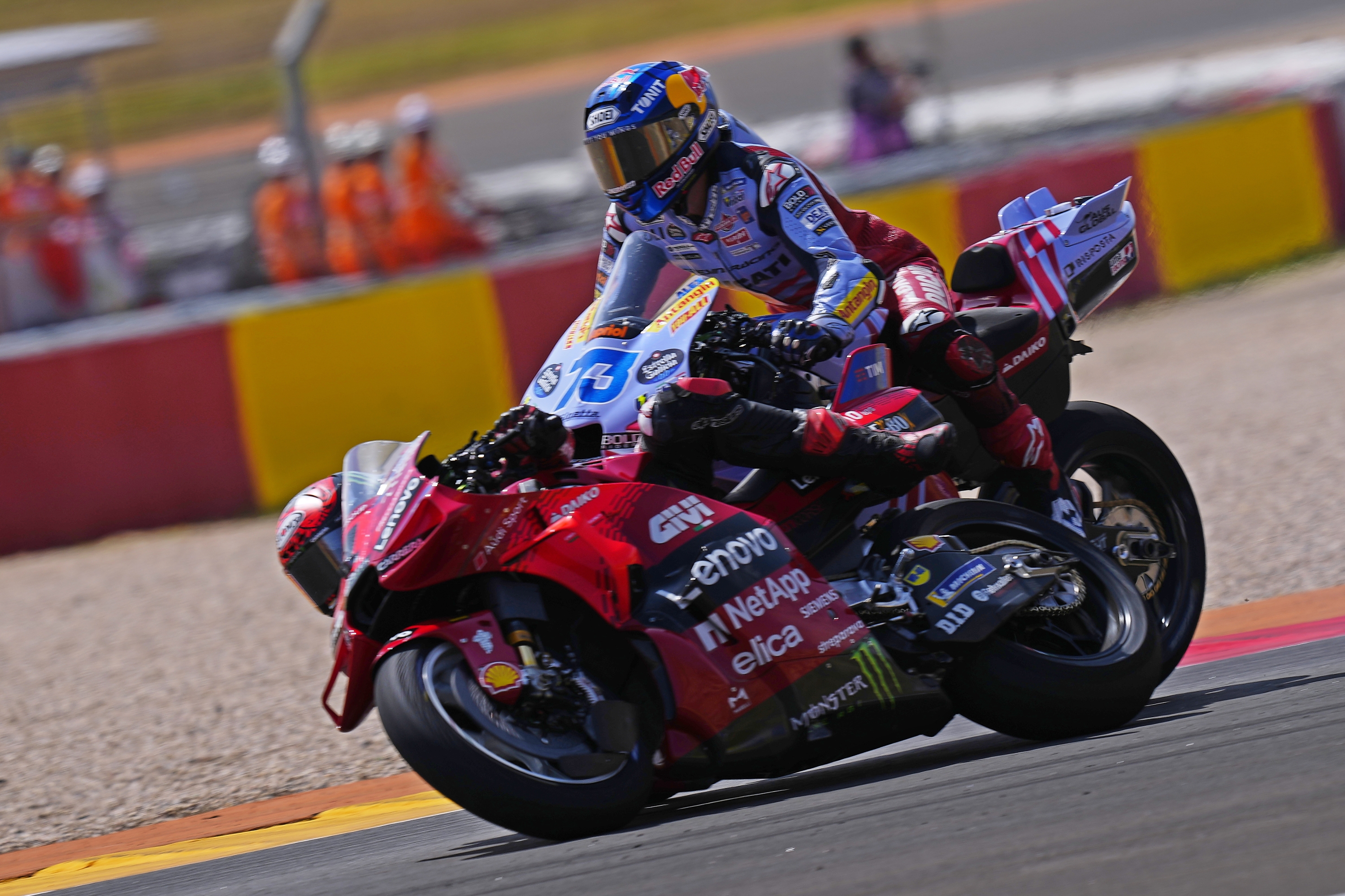 Spain's rider Alex Marquez of the Gresini Racing MotoGP, right and Italian rider Francesco Bagnaia of the Ducati Lenovo Team collide during the MotoGP race at the Aragon Motorcycle Grand Prix at the MotorLand Aragon circuit, in Alcaniz, Spain, Sunday, Sept. 1, 2024. (AP Photo/Jose Breton)